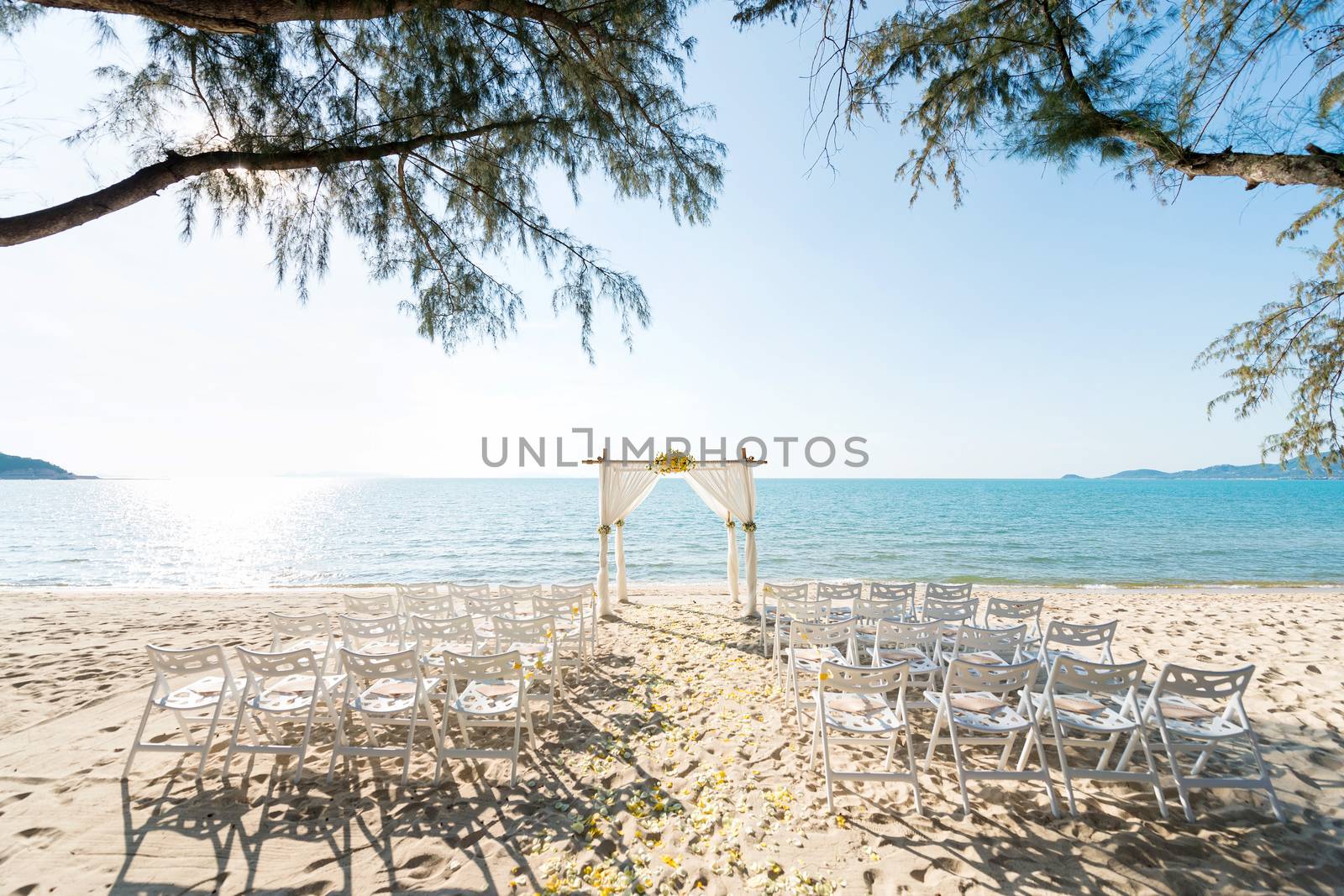 simple style wedding arch and decoration, venue, setup on tropical beach, outdoor beach wedding.