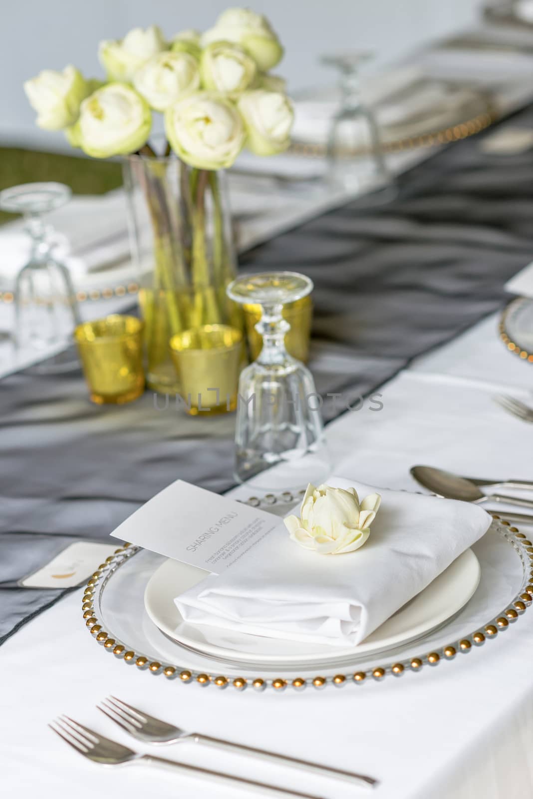 Elegance table set up with lotus flowers, selective focus.