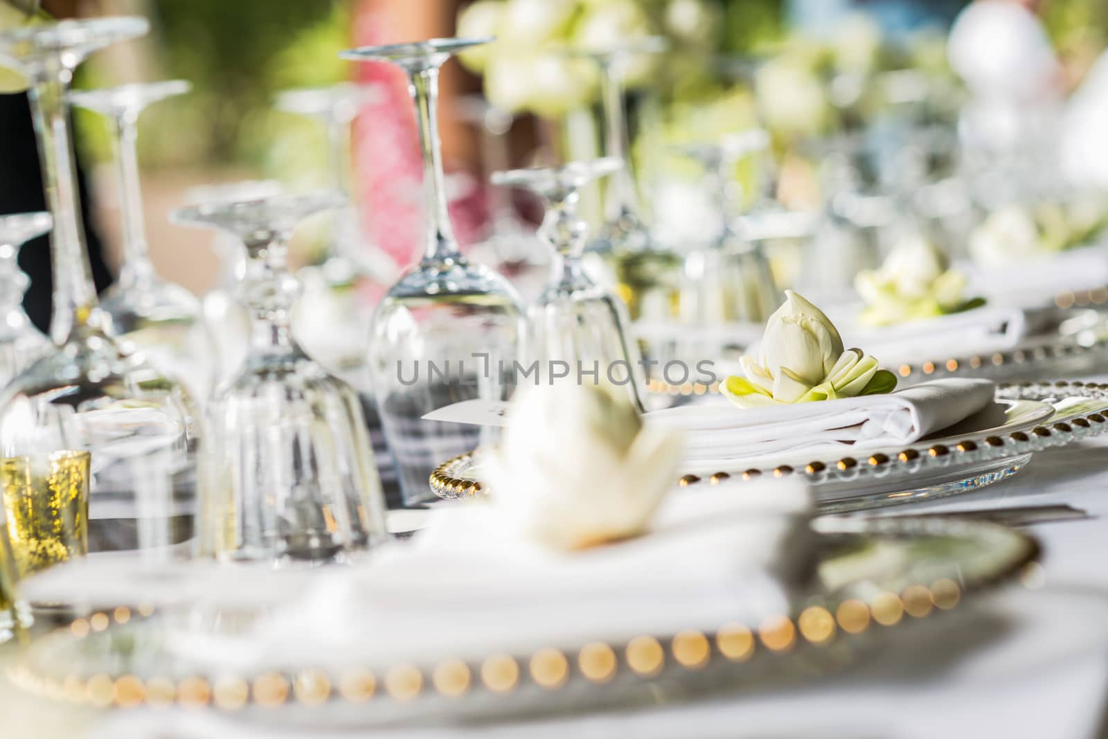 Elegance table set up with lotus flowers, selective focus.