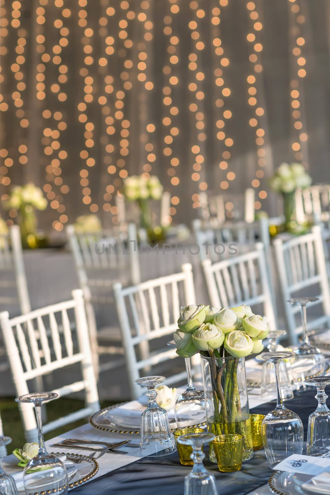 Elegance table set up with lotus flowers, selective focus. by hkt83000