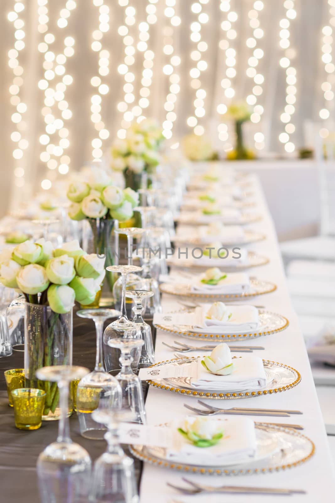 Elegance table set up with lotus flowers, selective focus.