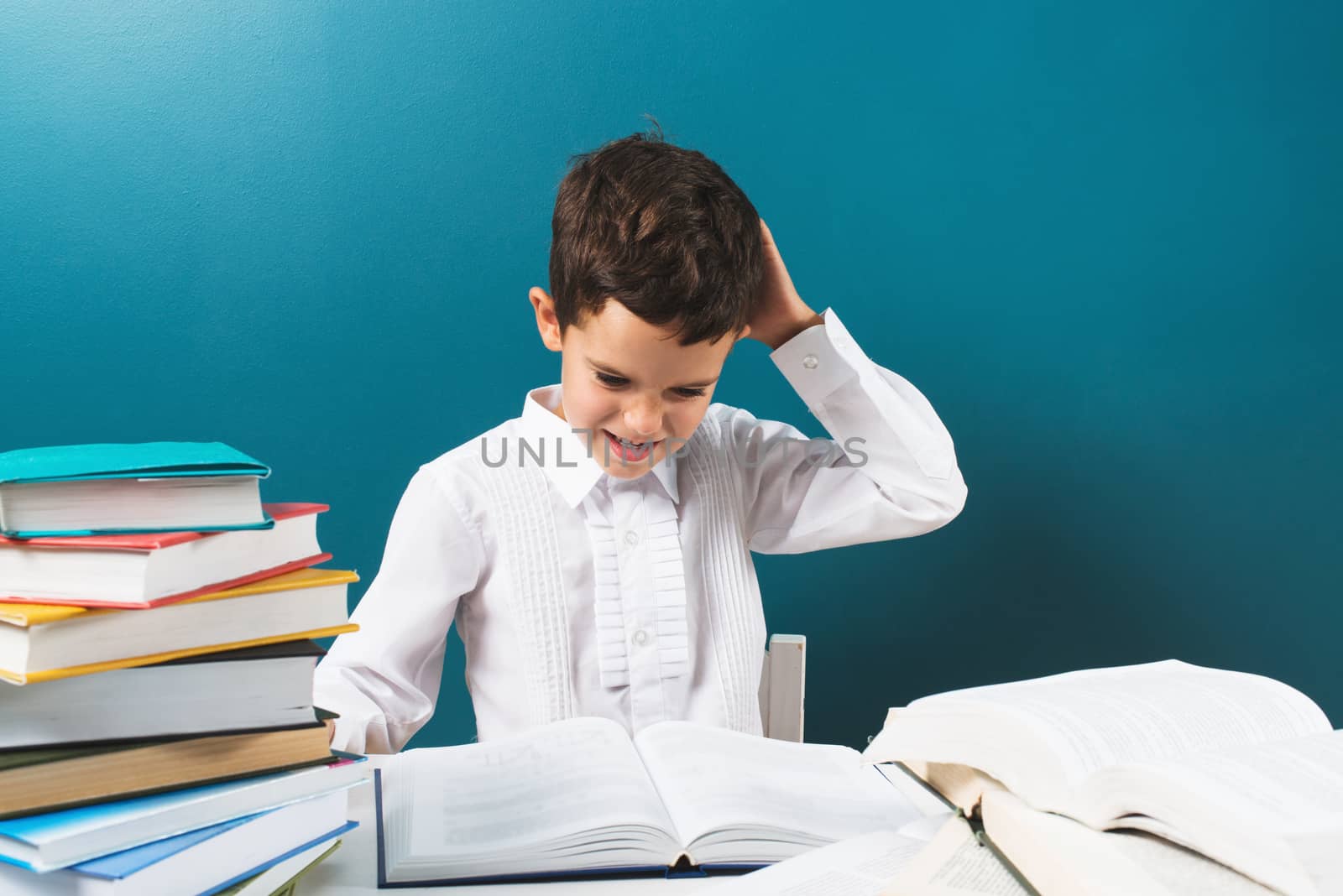 Student at elementary school thinking about problem solving, blue background