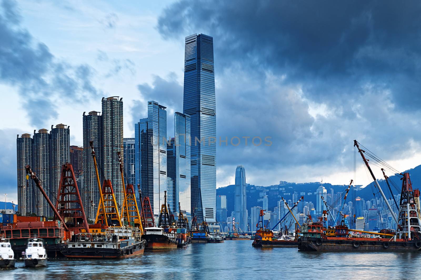 International Commerce Center ICC Building Kowloon Hong Kong Harbor with cargo ship