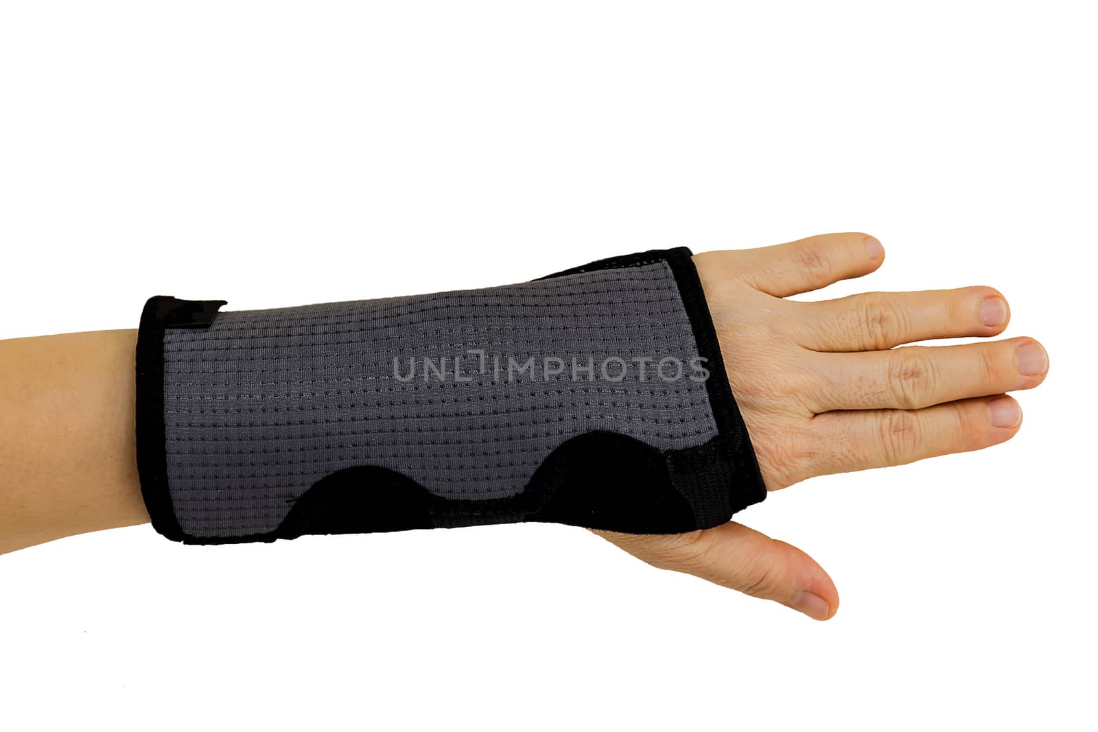 Woman pain hand in black wrist bandage with isolated.