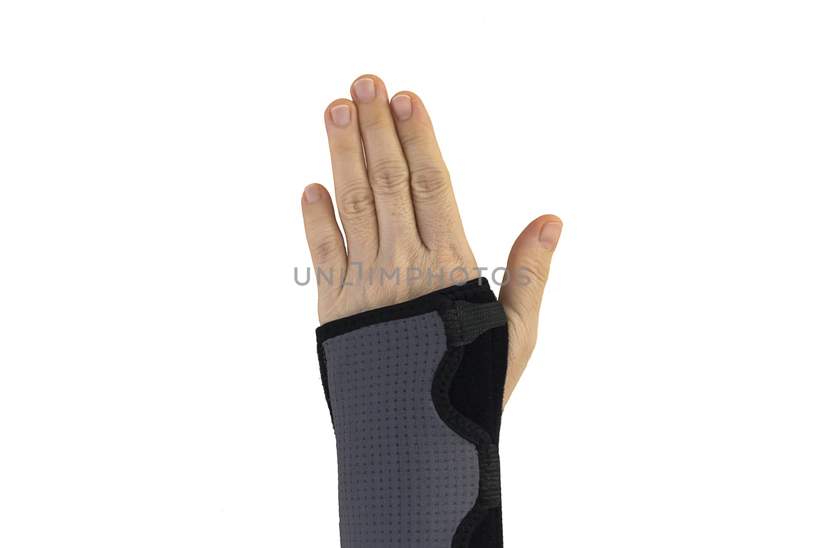 Woman pain hand in black wrist bandage with isolated.