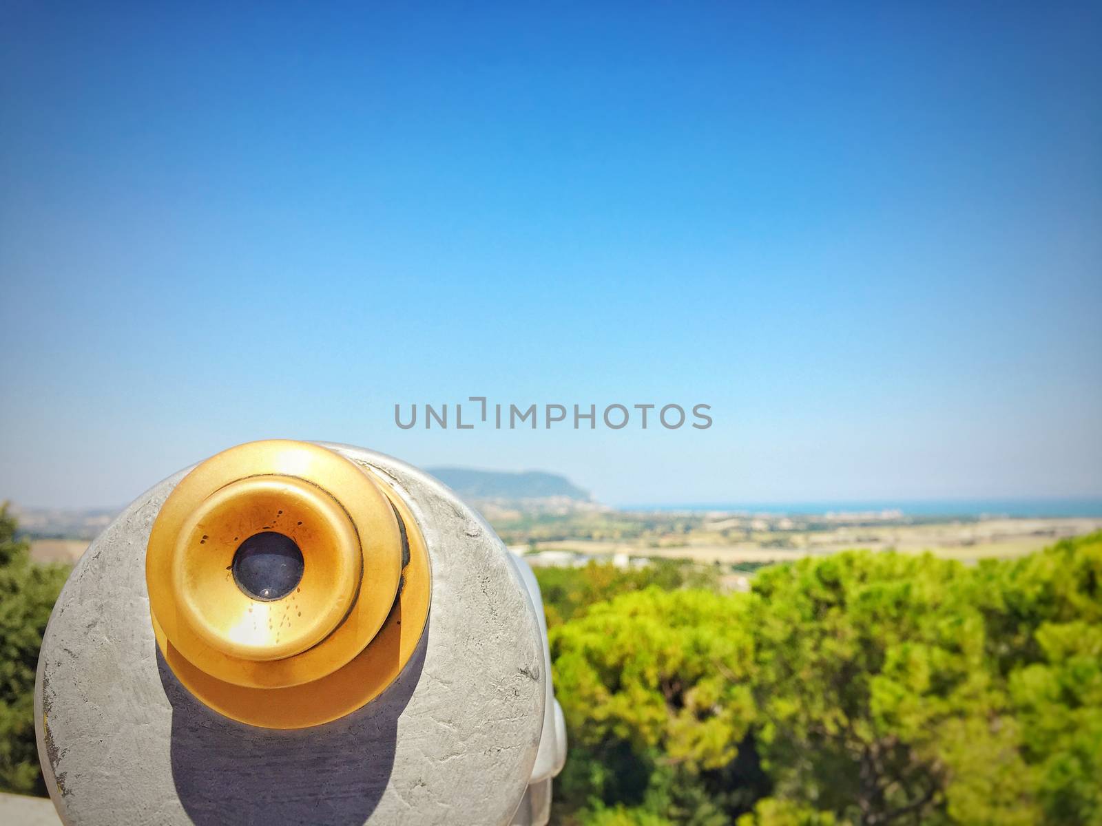 close up of a telescope watching mount Conero and the adriatic sea