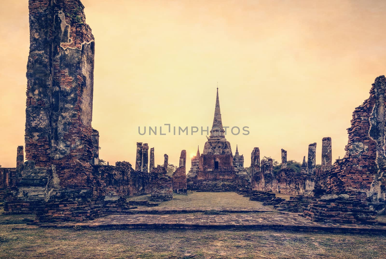 Vintage style add texture effect, ancient ruins and pagoda of Wat Phra Si Sanphet old temple famous attractions during sunset at Phra Nakhon Si Ayutthaya Historical Park, Ayutthaya Province, Thailand