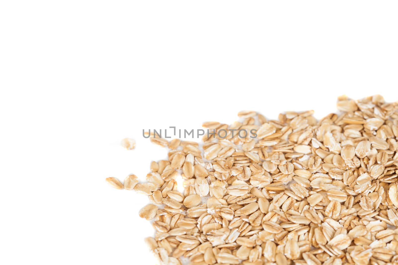 Oats flakes pile on white background
