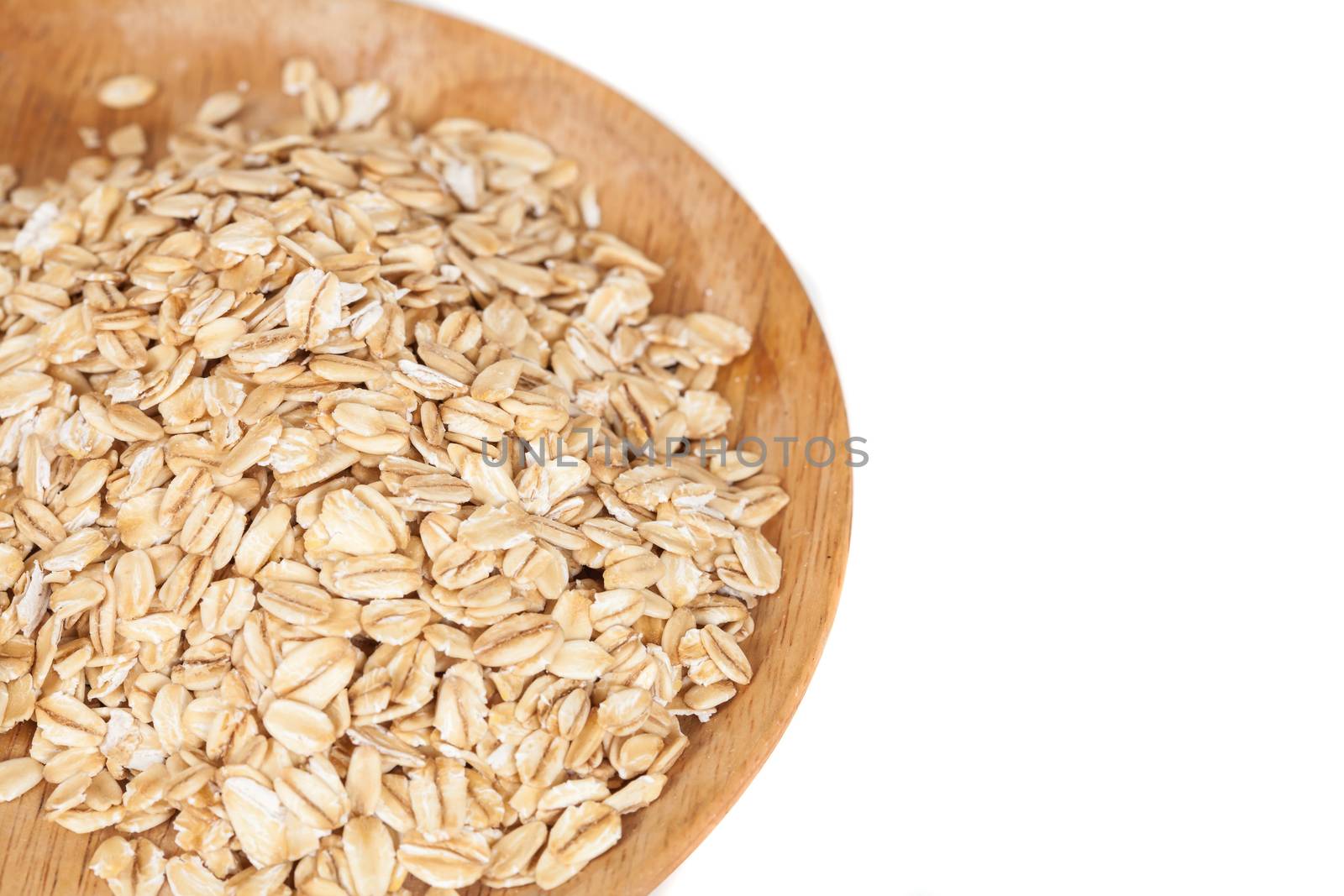 dish wood with oats flakes pile