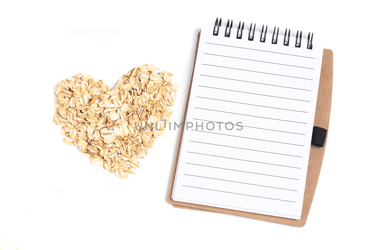 oat flakes in a shape of heart and book note