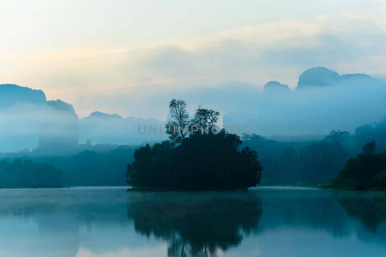 A Small Island On A Slightly Foggy before the dawn.