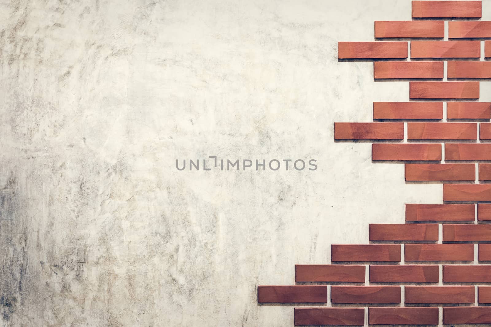 Vintage red bricks pattern on polished cement wall.