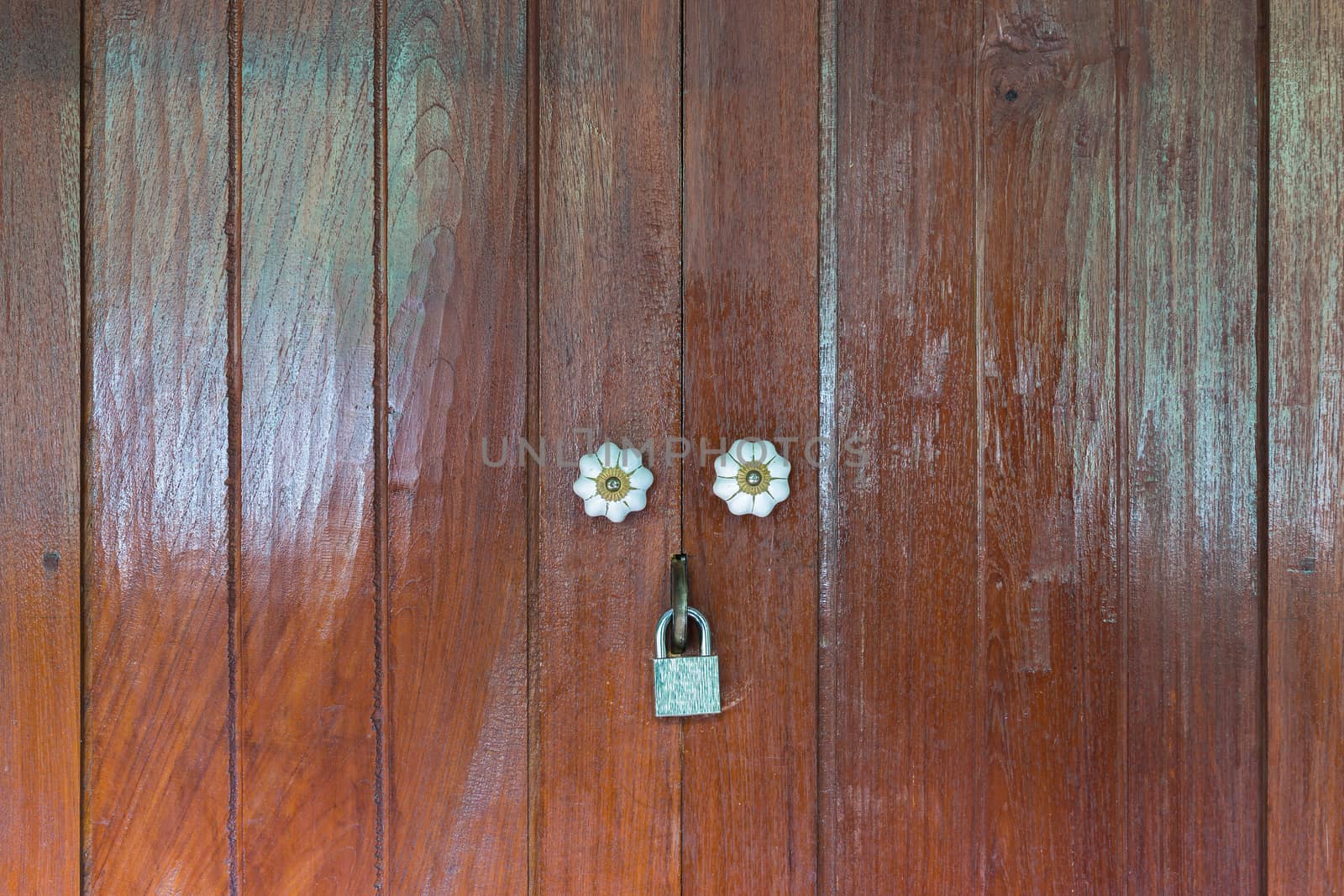 Thai style wooden door with two handle.