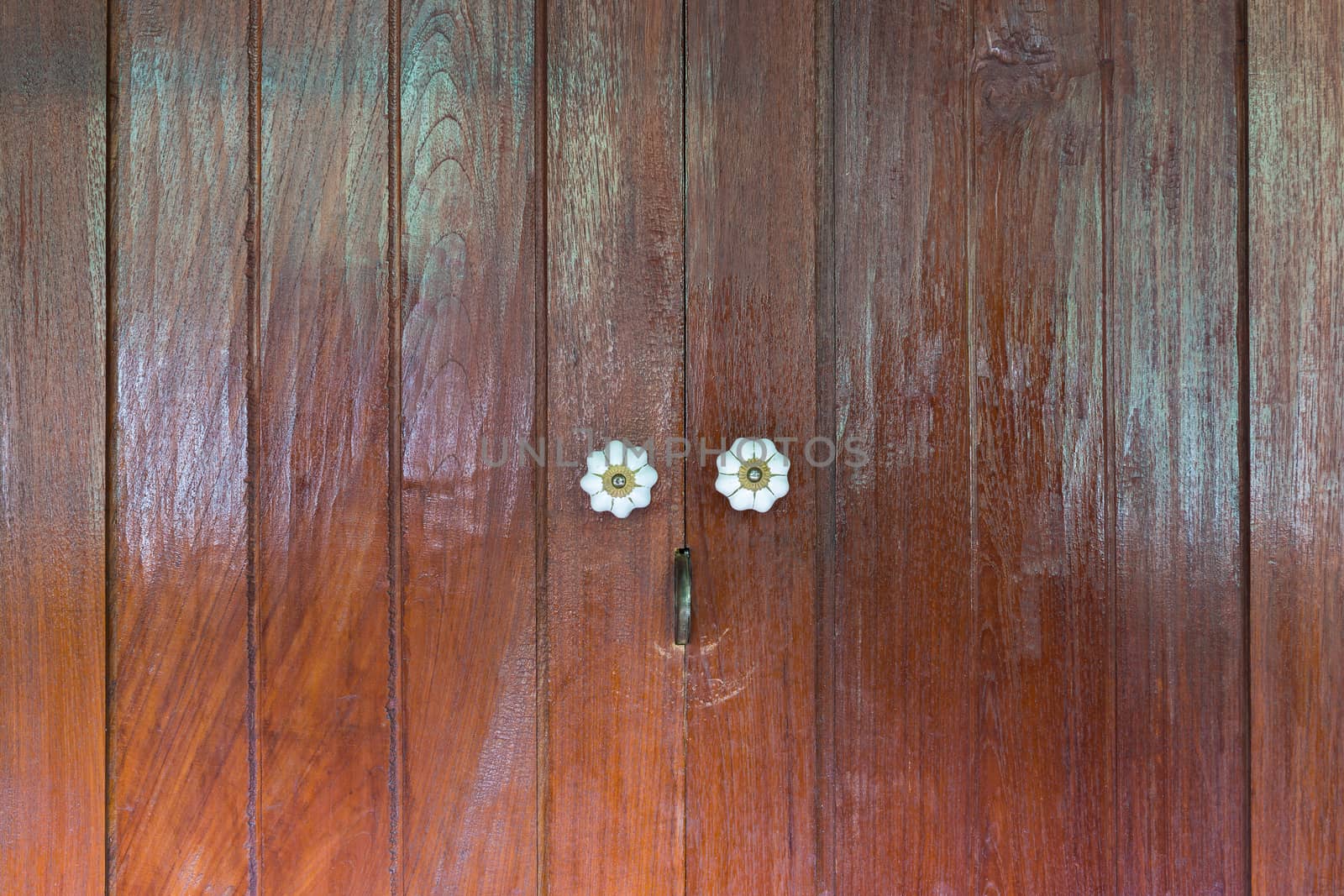 Thai style wooden door with two handle.