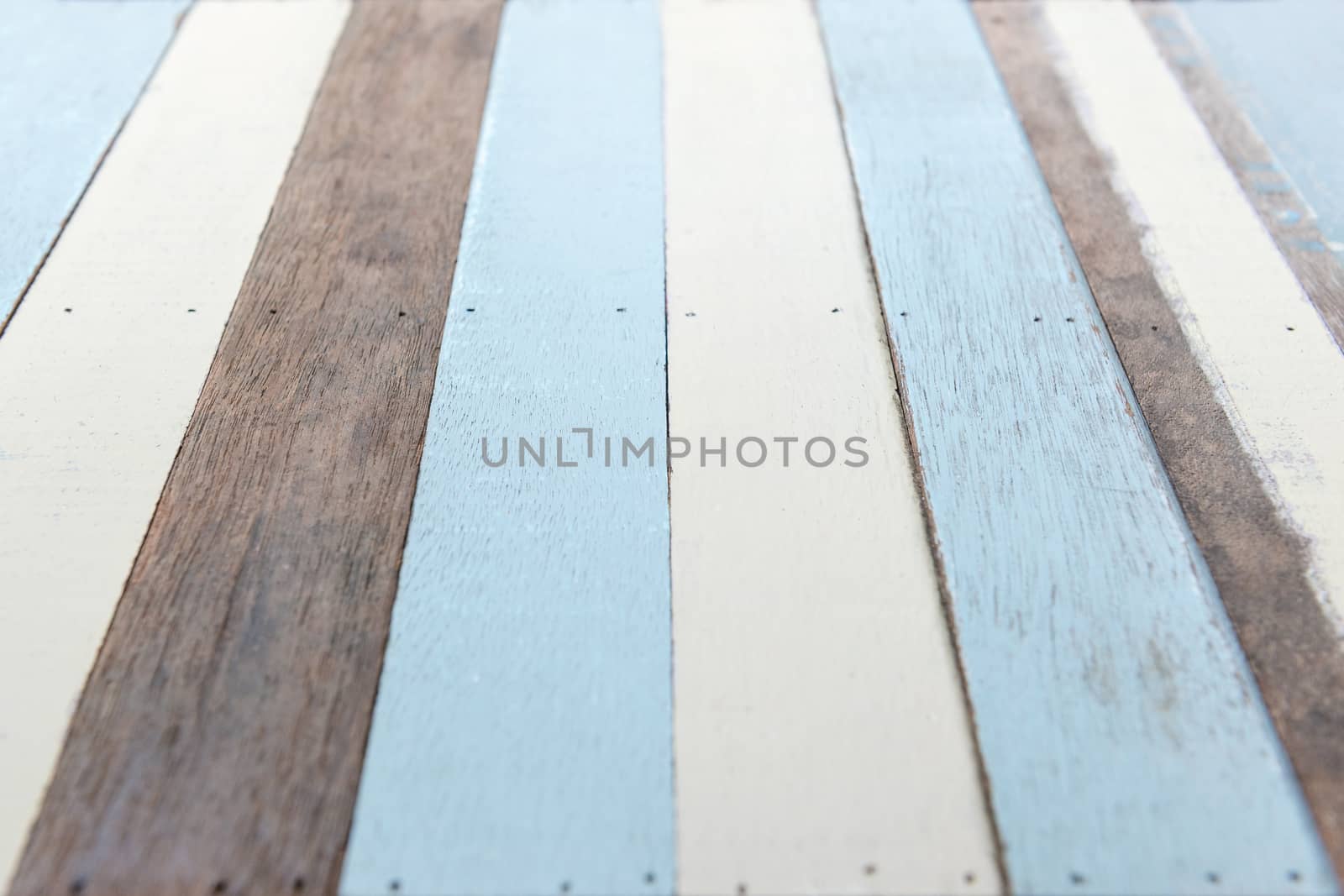 Perspective wooden plank on natural, white and blue color, selective focus.