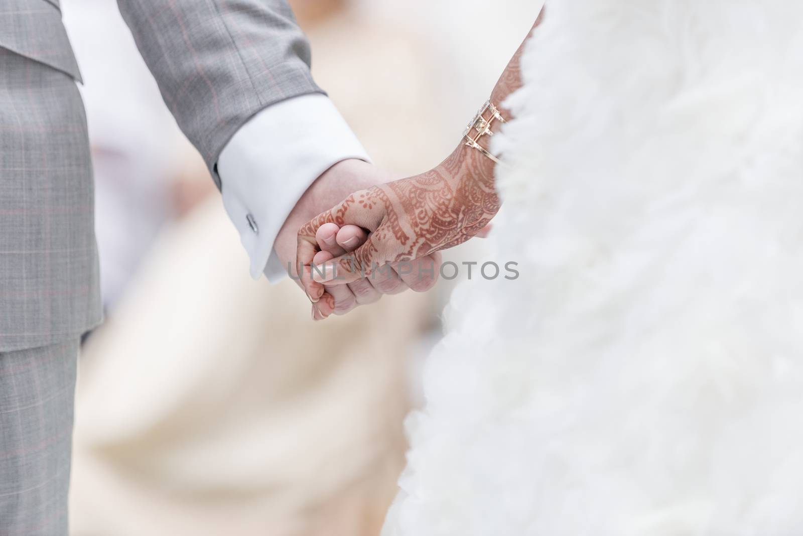 Close-up Holding Hands in indian wedding ritual.