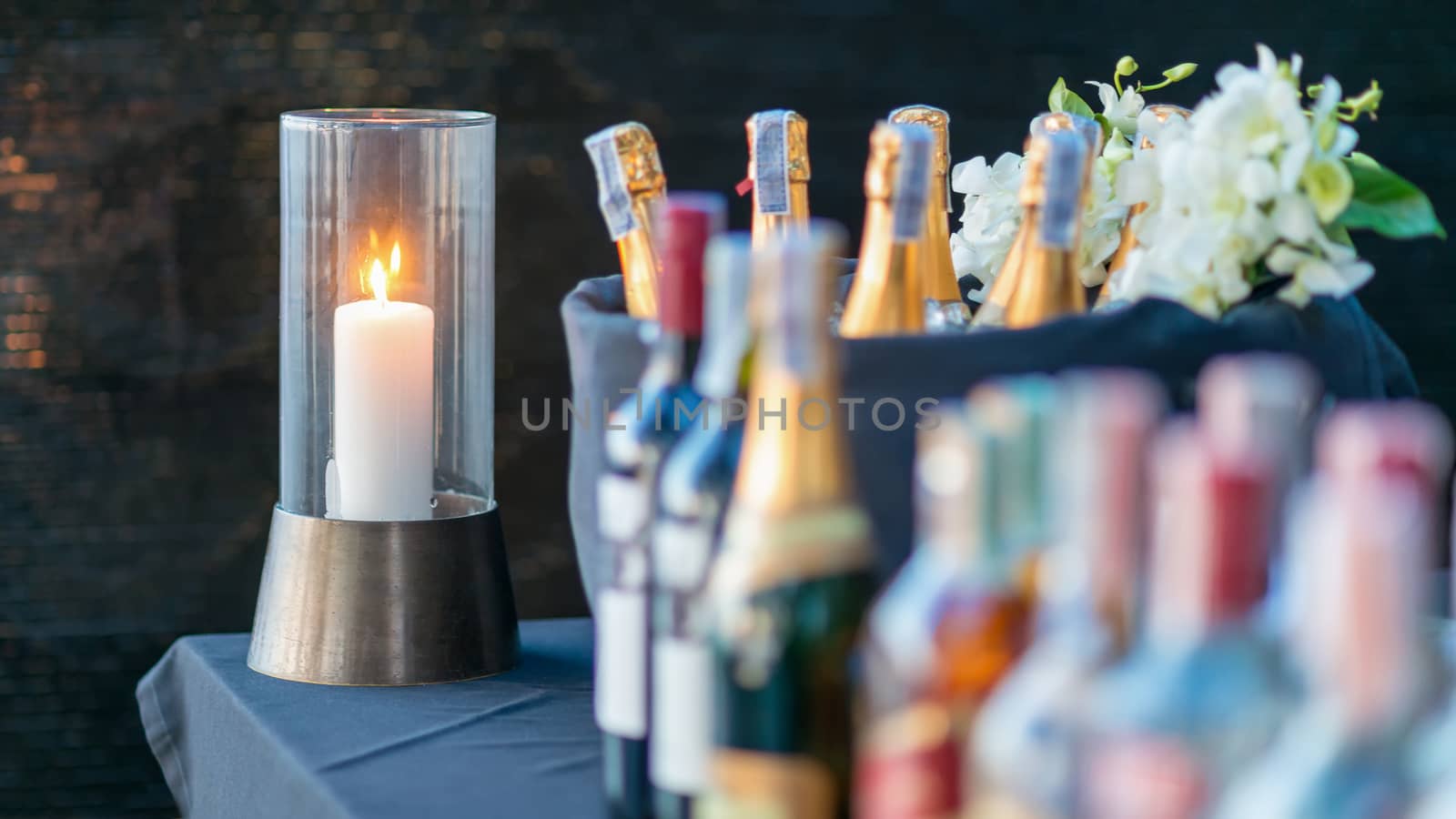 A candle light on brass stand in party. by hkt83000