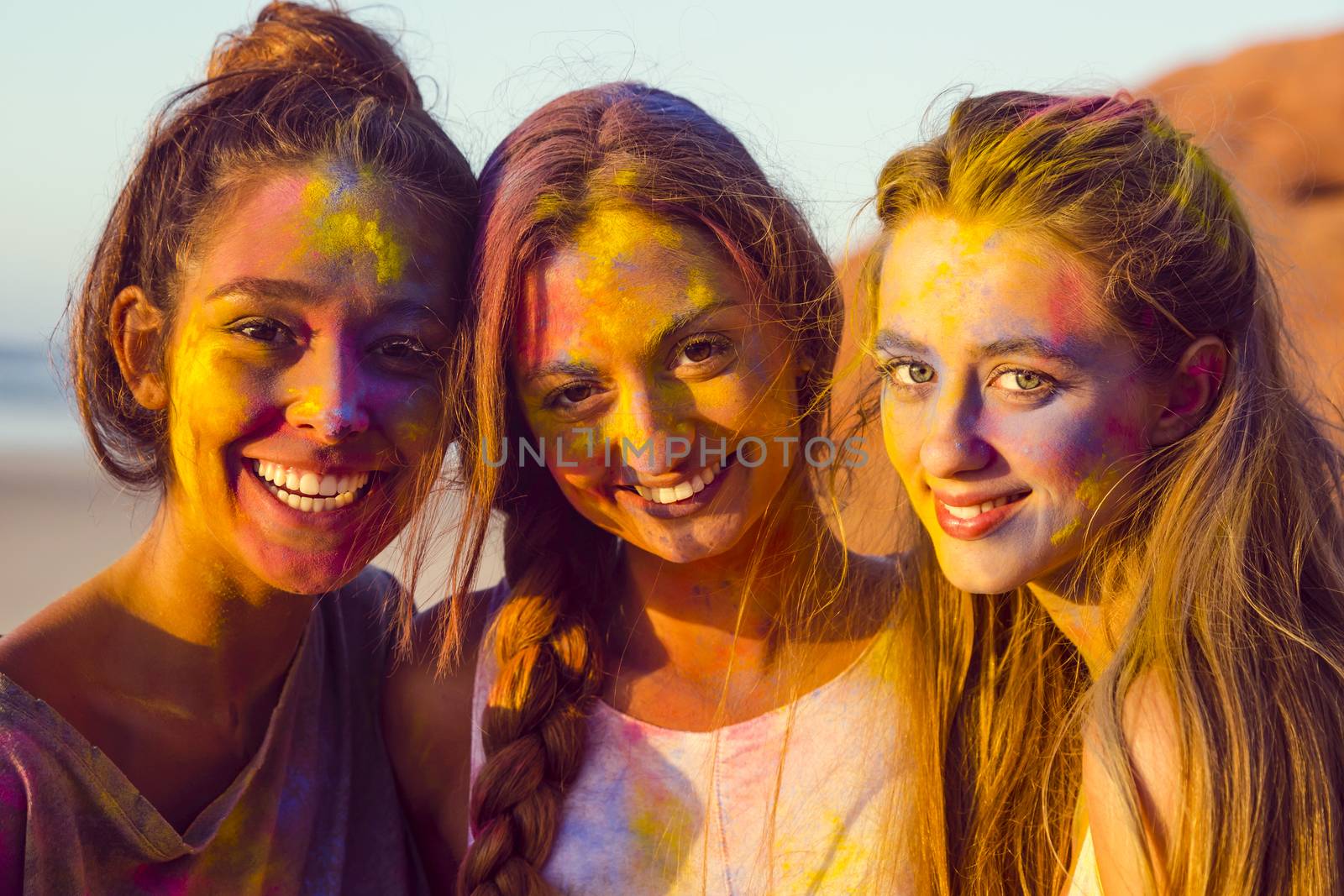 Best friends full of colored powder all over the body