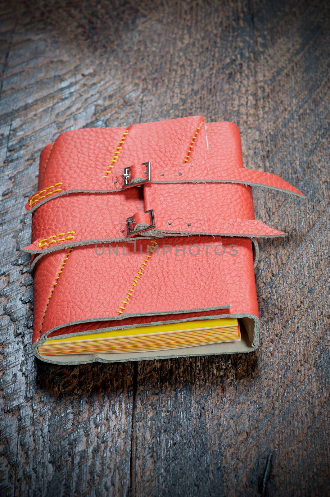 Red Notebook  on the  wooden background