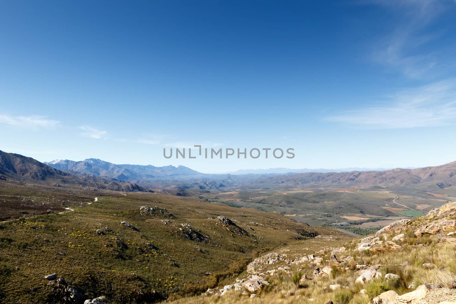 Heading Up - The Swartberg mountains are a mountain range in the Western Cape province of South Africa. It is composed of two main mountain chains running roughly east-west along the northern edge of the semi-arid Little Karoo.