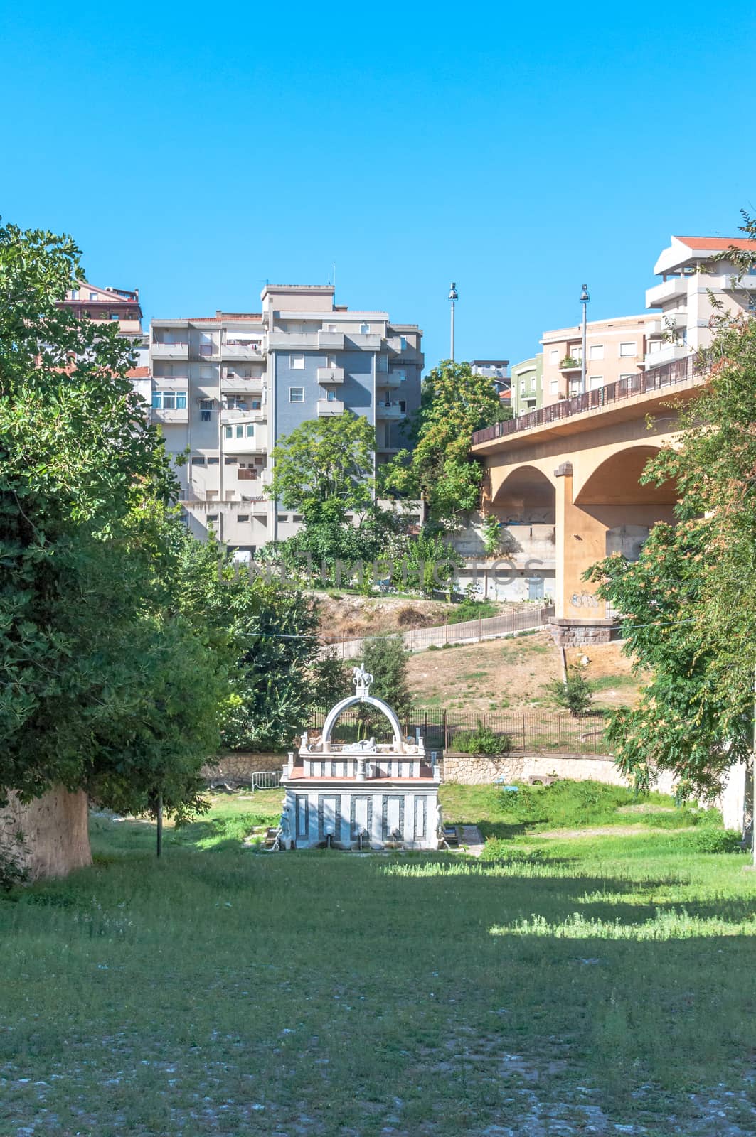 Ancient fountain in the middle of italian city