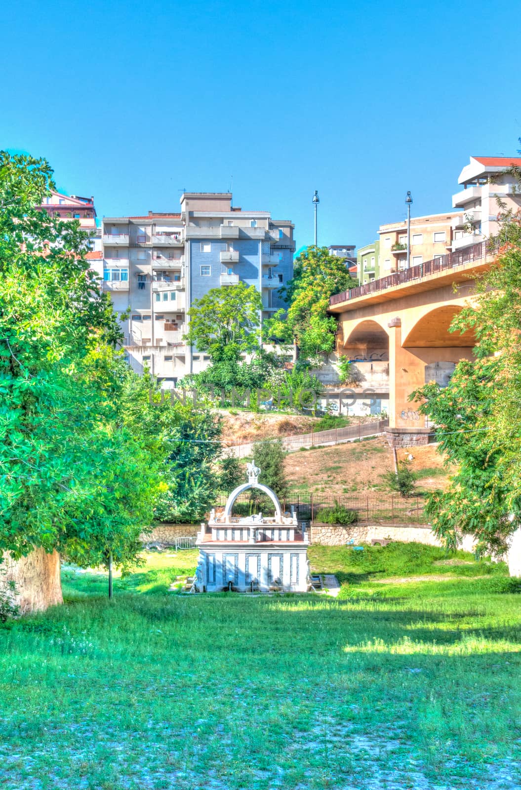 Ancient fountain in the middle of italian city