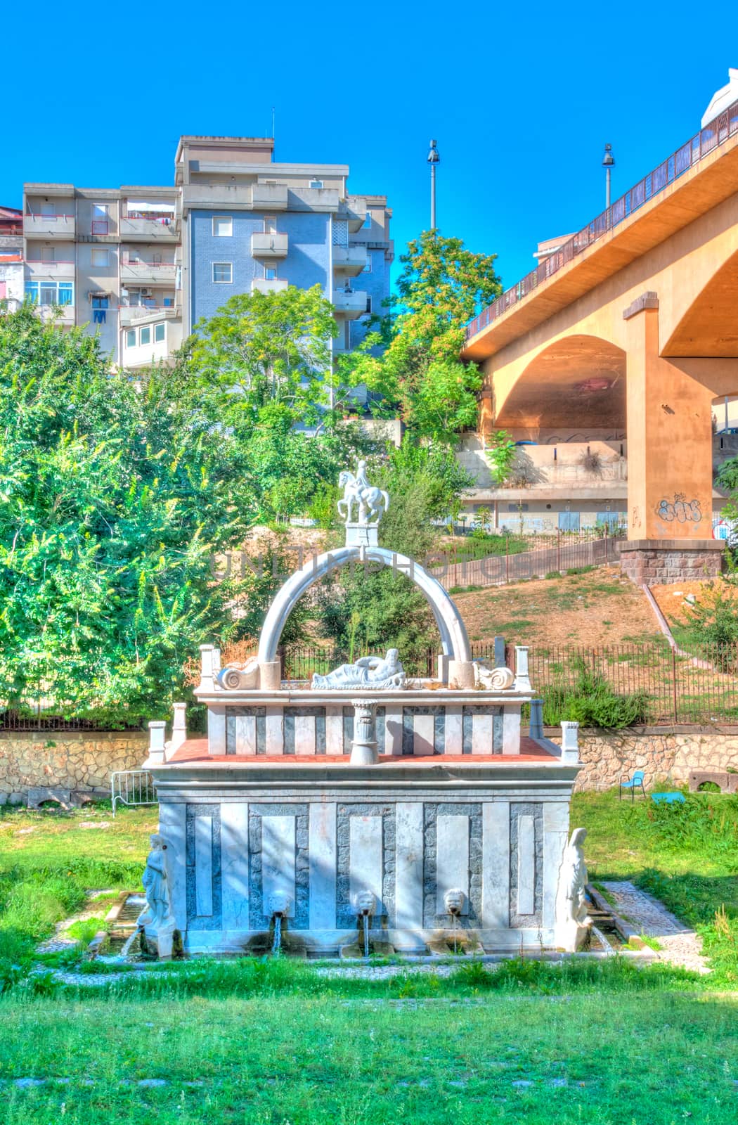 Ancient fountain in the middle of italian city