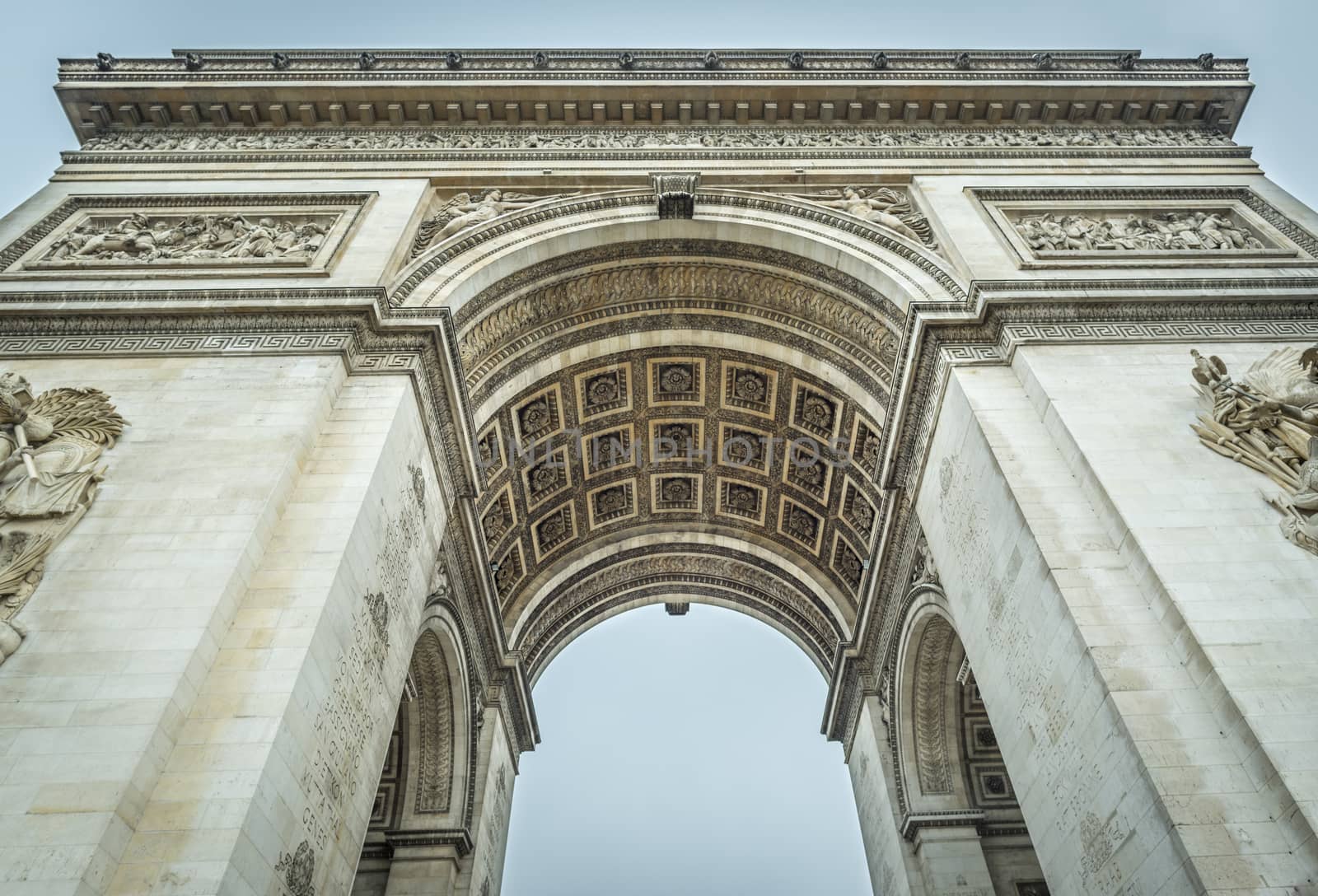 Arc de Triomphe, famous historical building placed where the Champ Elysees boulevard starts. Picture captured in Paris, France.