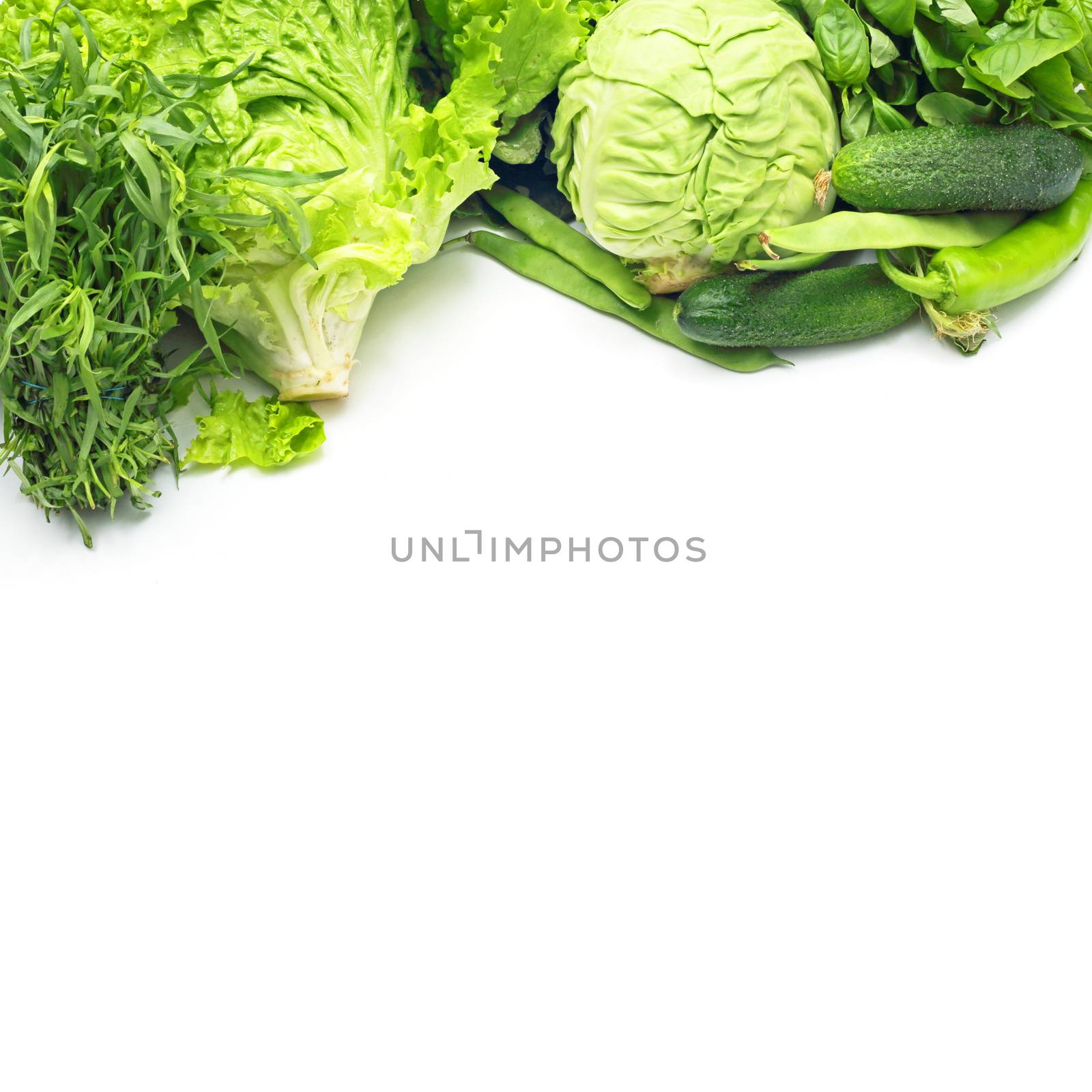 Pile of green vegetables isolated on white background with copy space