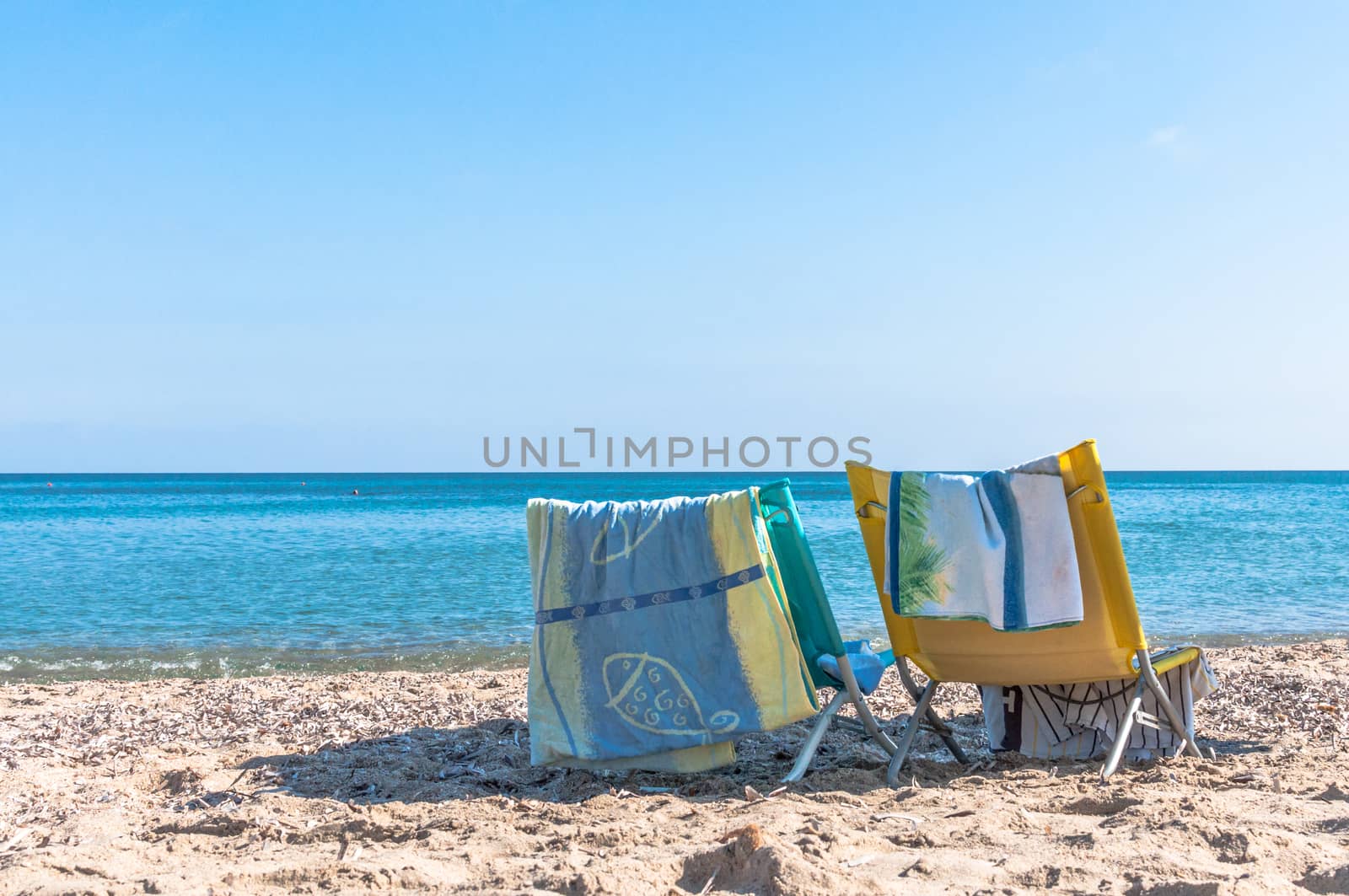 white chair on the beach by replica