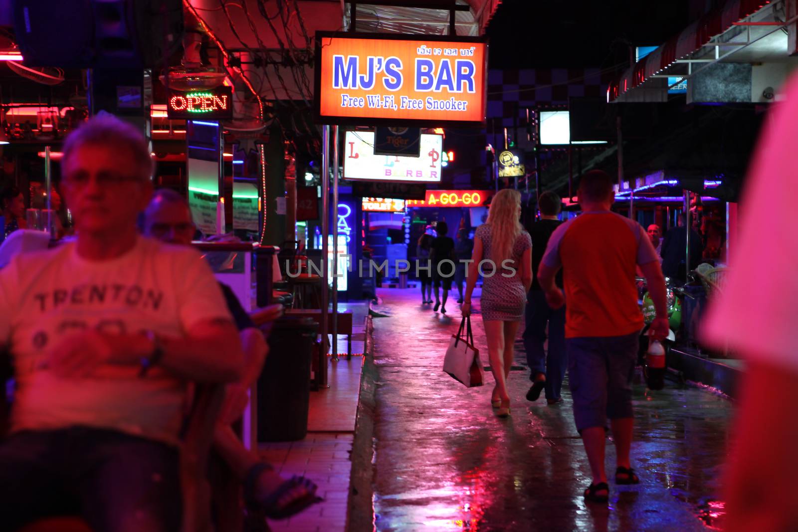 Nightlife on walking street in Thailand by ssuaphoto