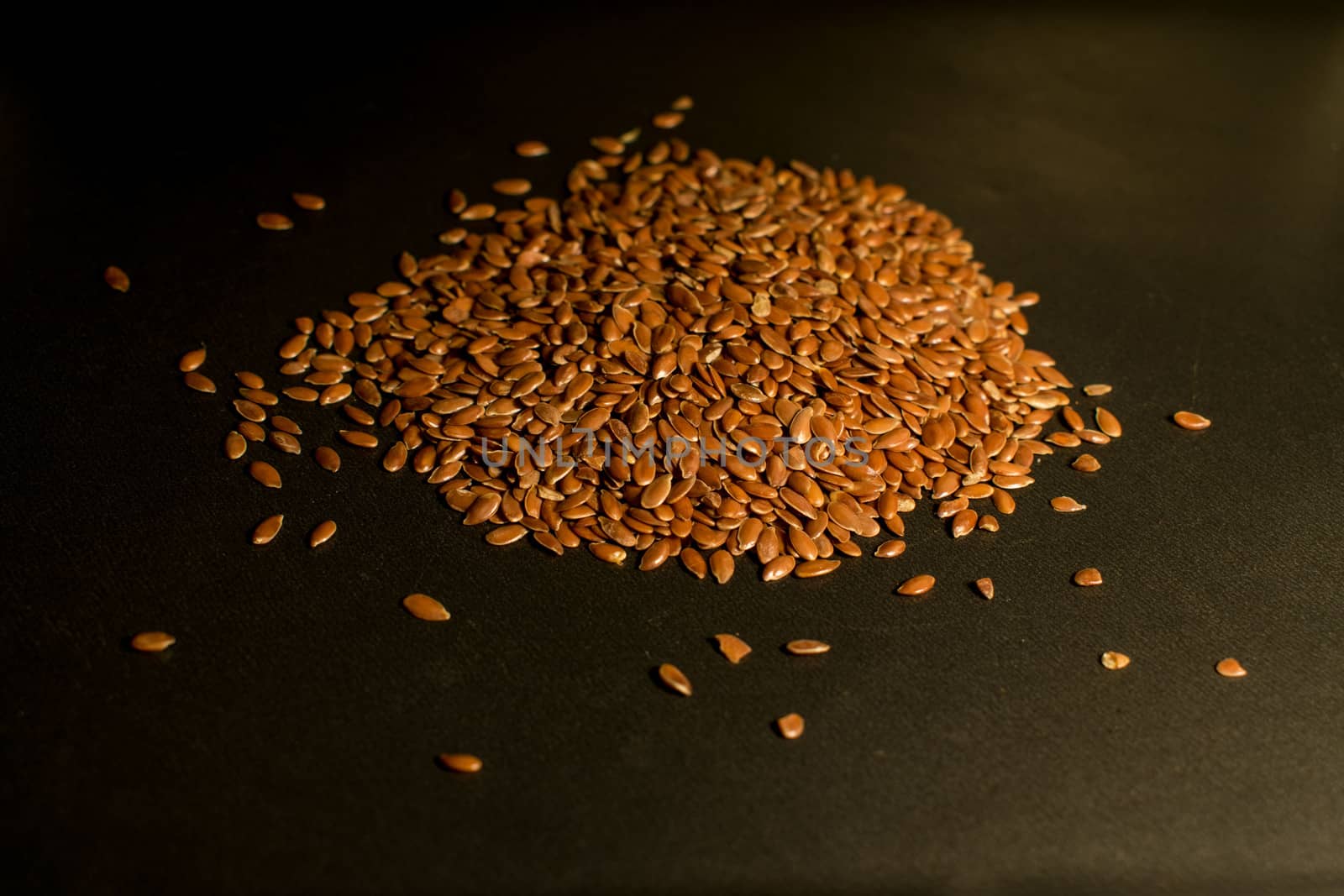 Flax seeds in a dark background