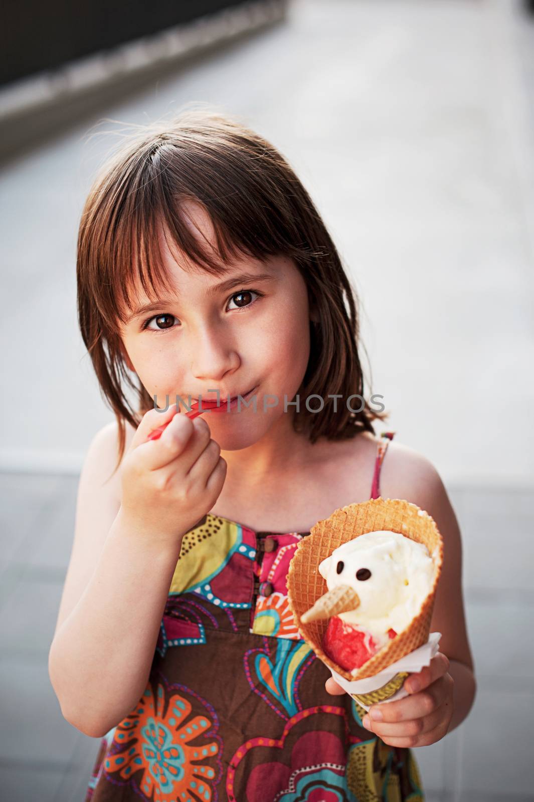 Cute girl eating ice-cream by Olinkau