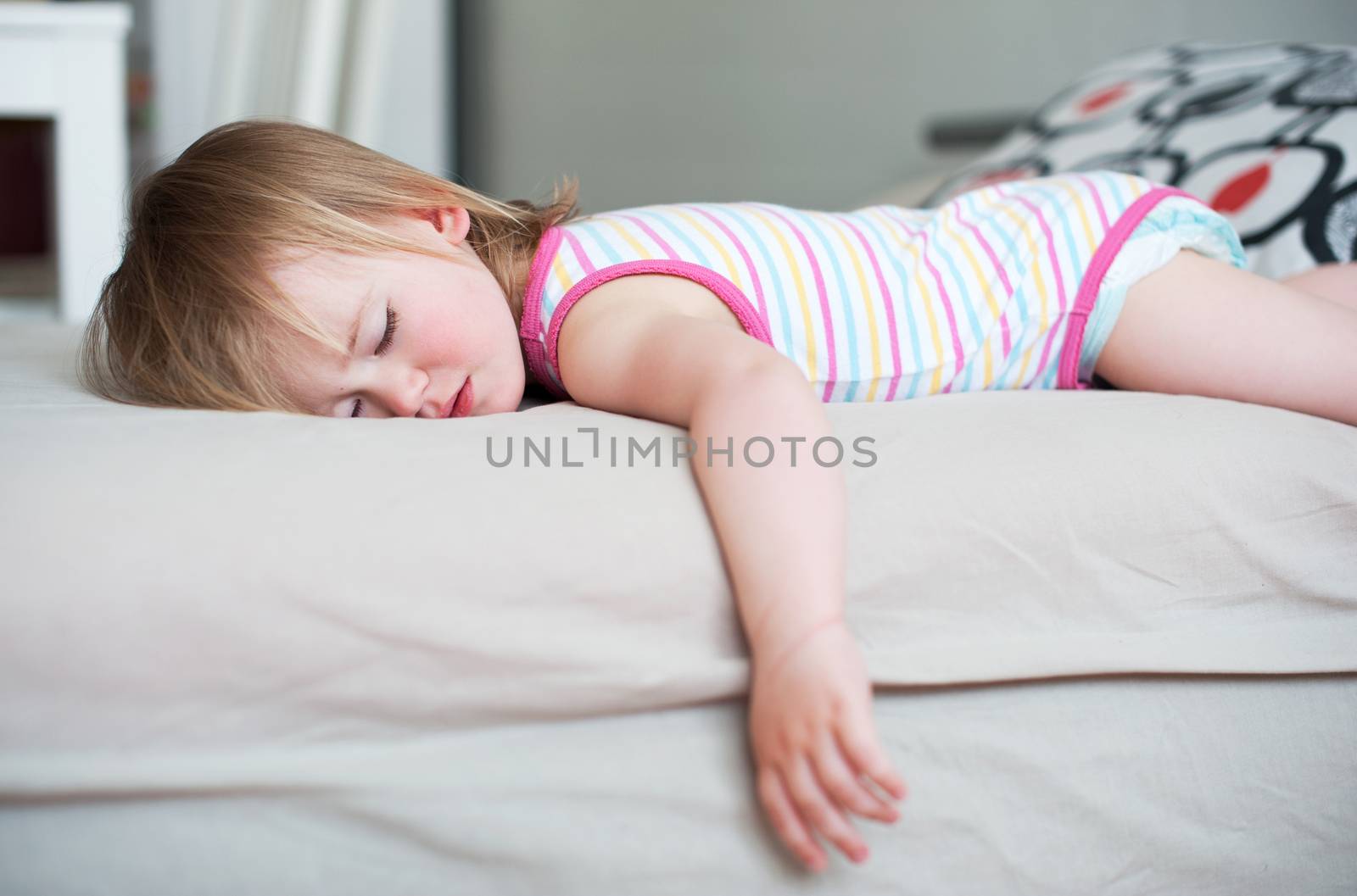 Sick baby girl lying in bed  by Olinkau