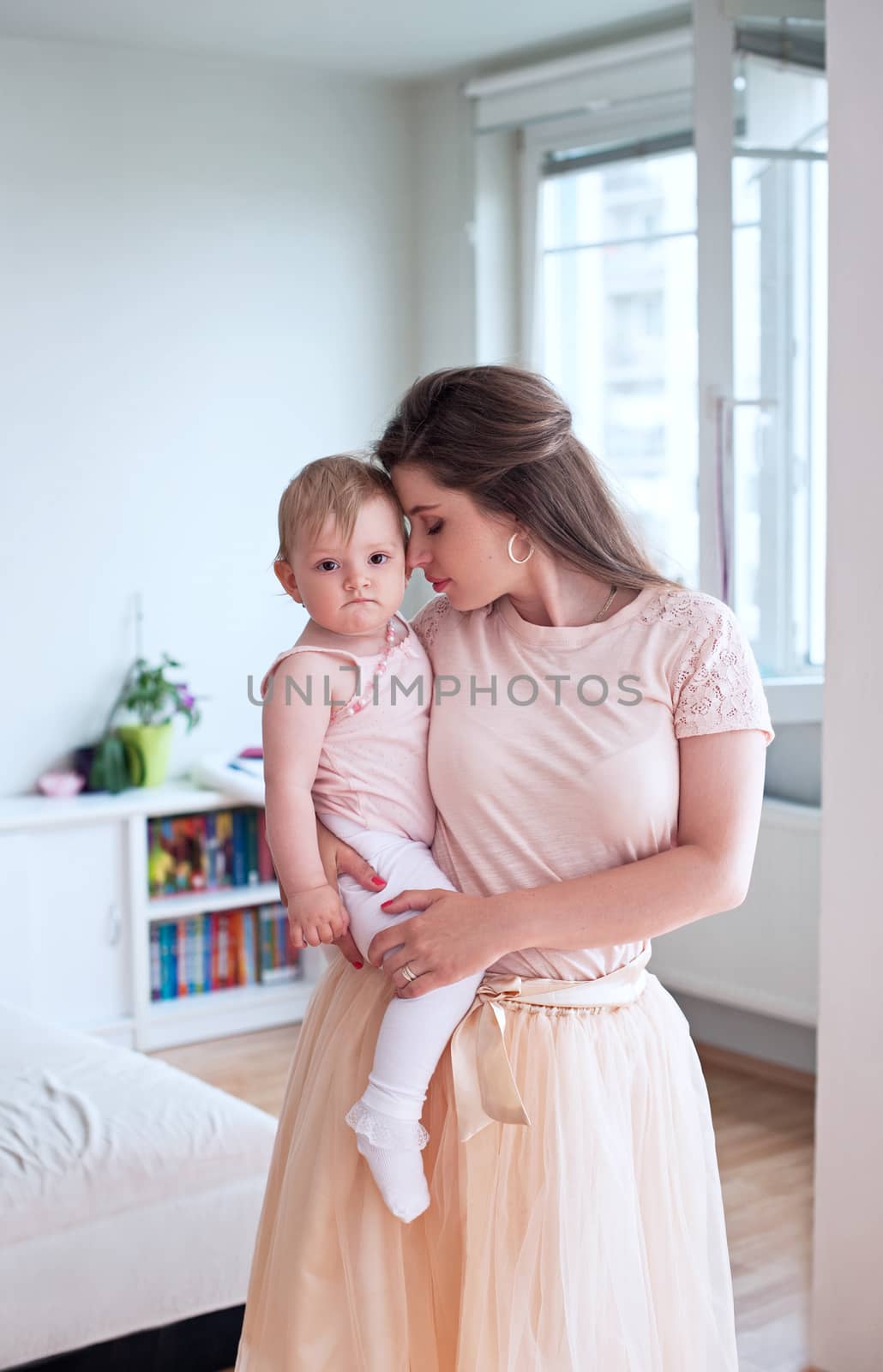 Family, child and parenthood concept - happy mother with her baby