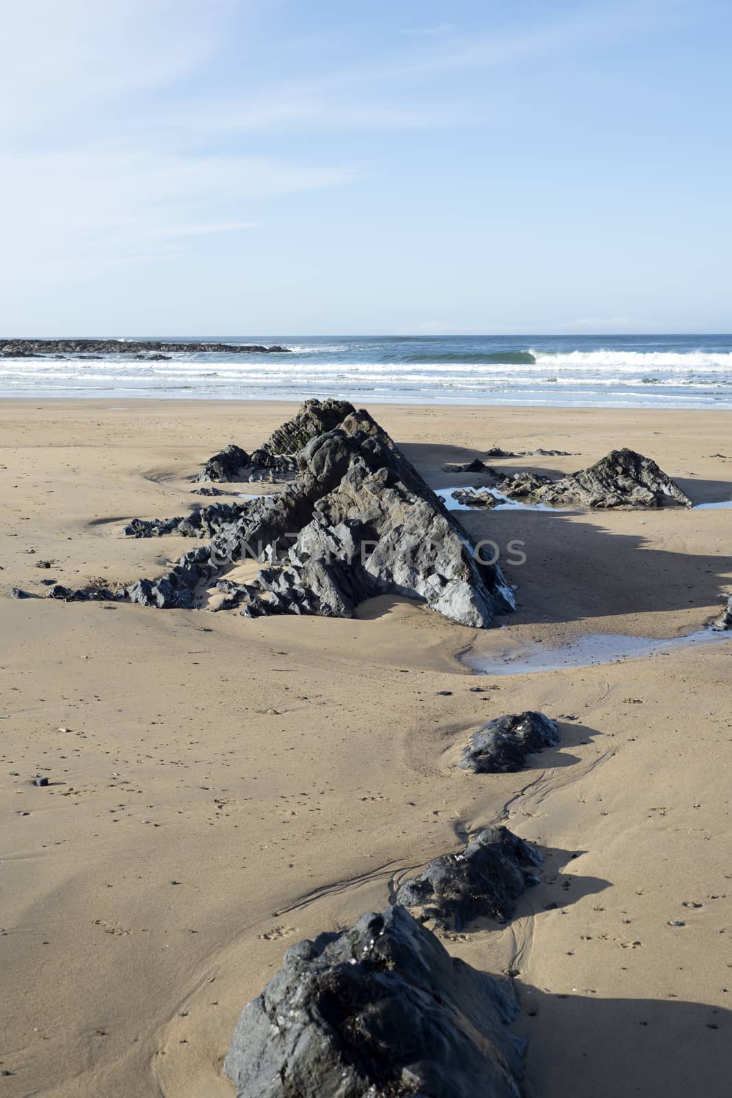 rock formations on sandy beach in Ballybunion Ireland