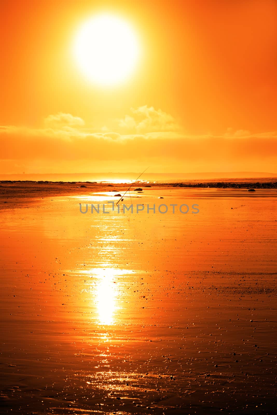 mounted fishing rod on a sunset beach in county Kerry Ireland