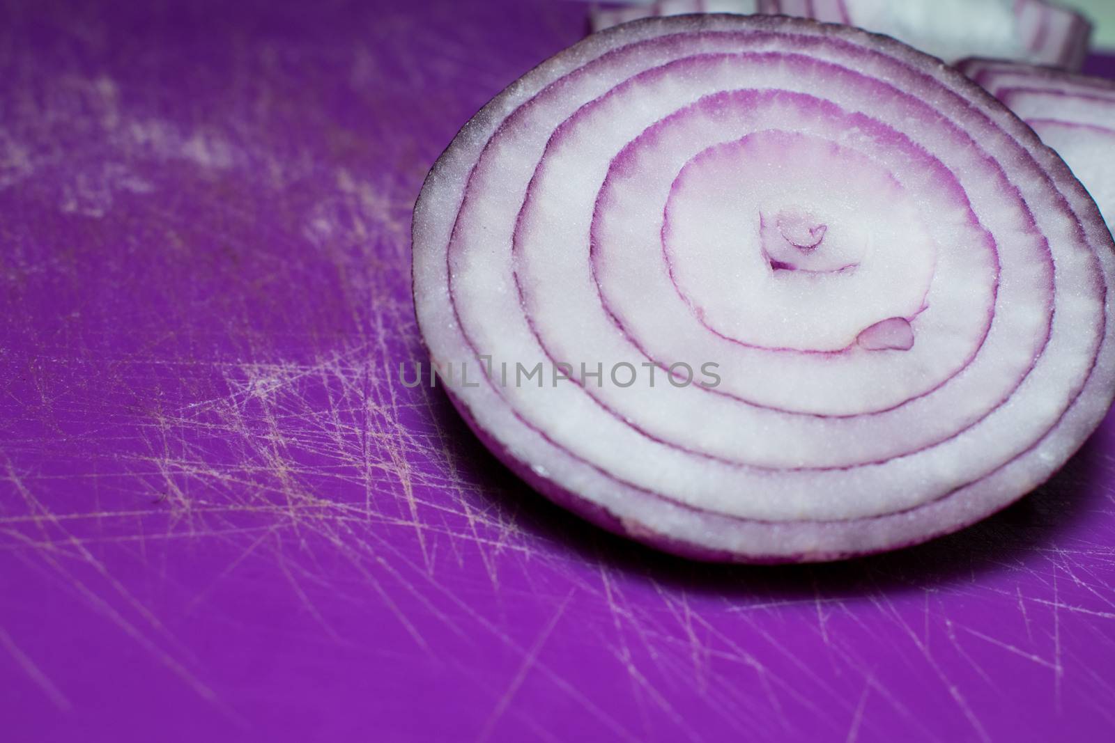 Cutten Tropea onions in a purple background