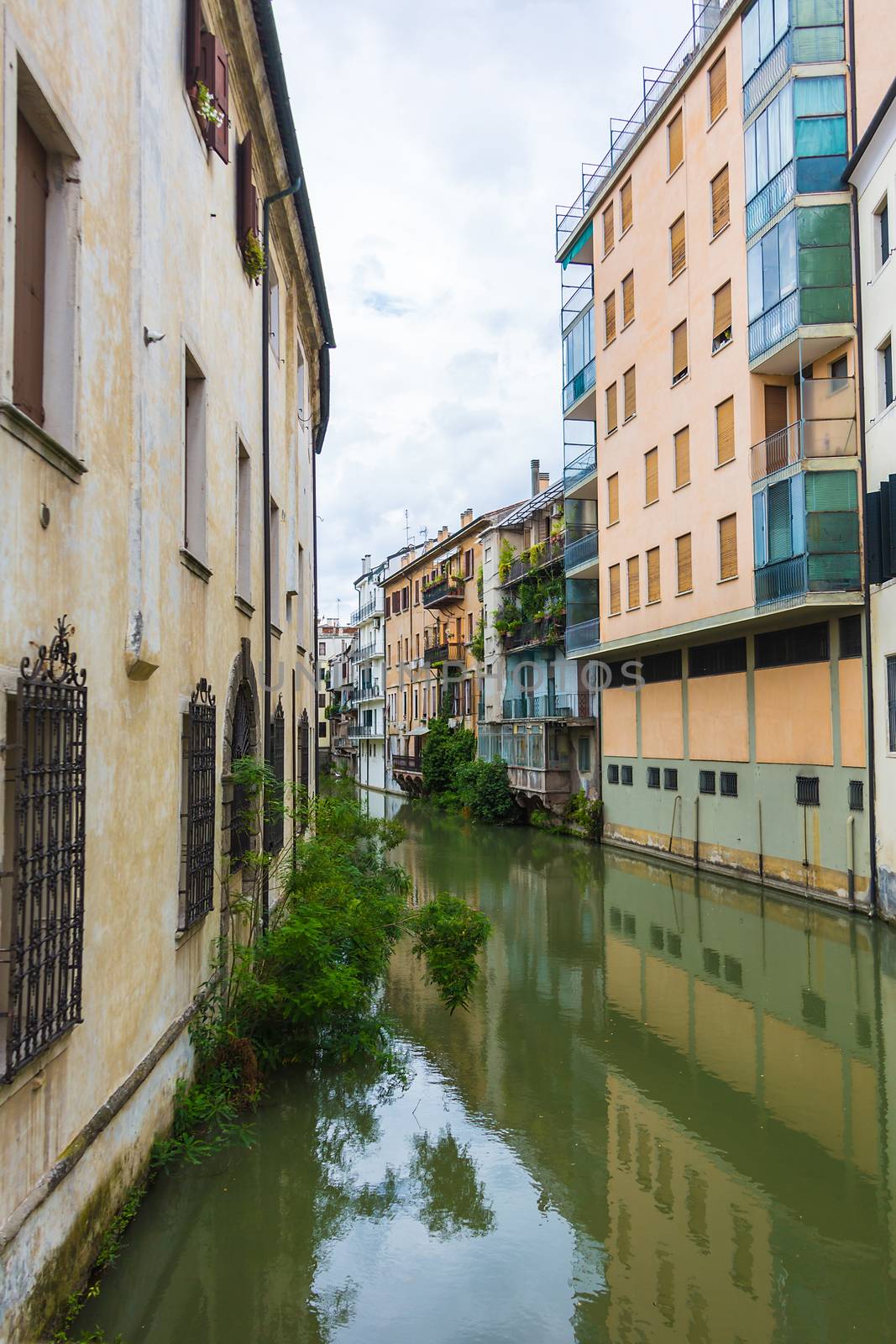 canal San Massimo runs among residential houses in the centre of the old city Padua