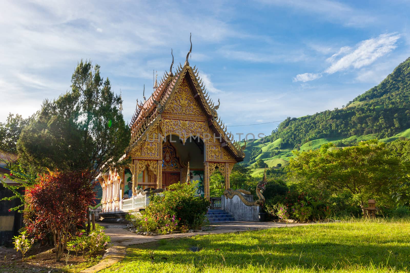 Temple in thailand near mountain valley during sunrise Natural s by nopparats