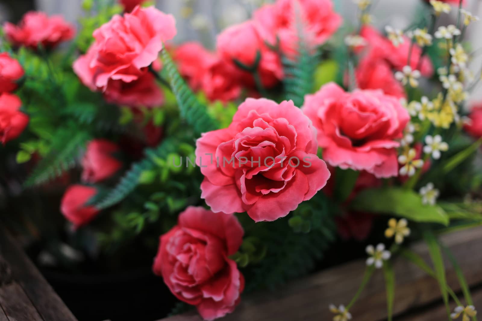 Red Artificial Rose flower in basket