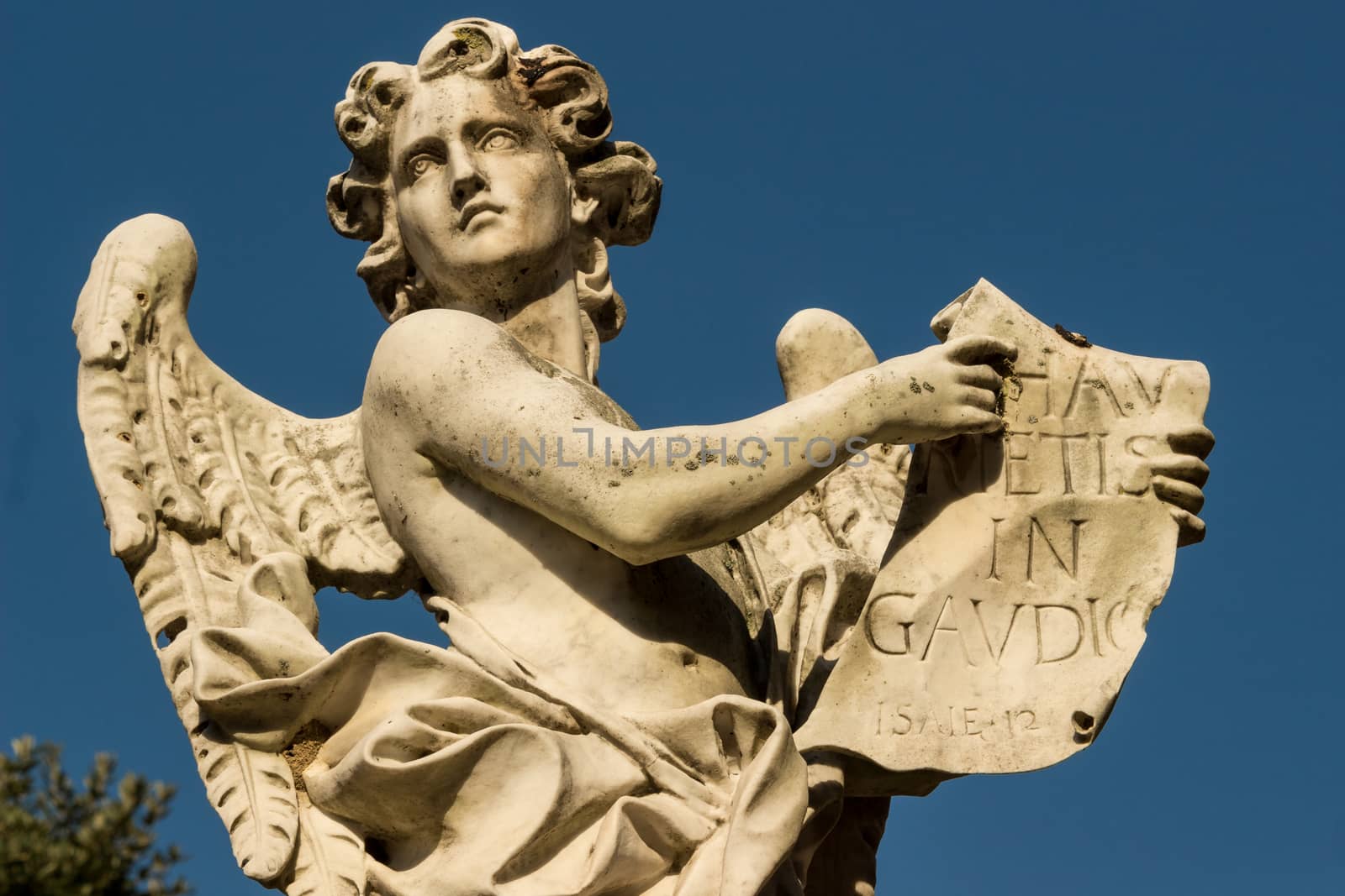 A statue of an angel with the table.