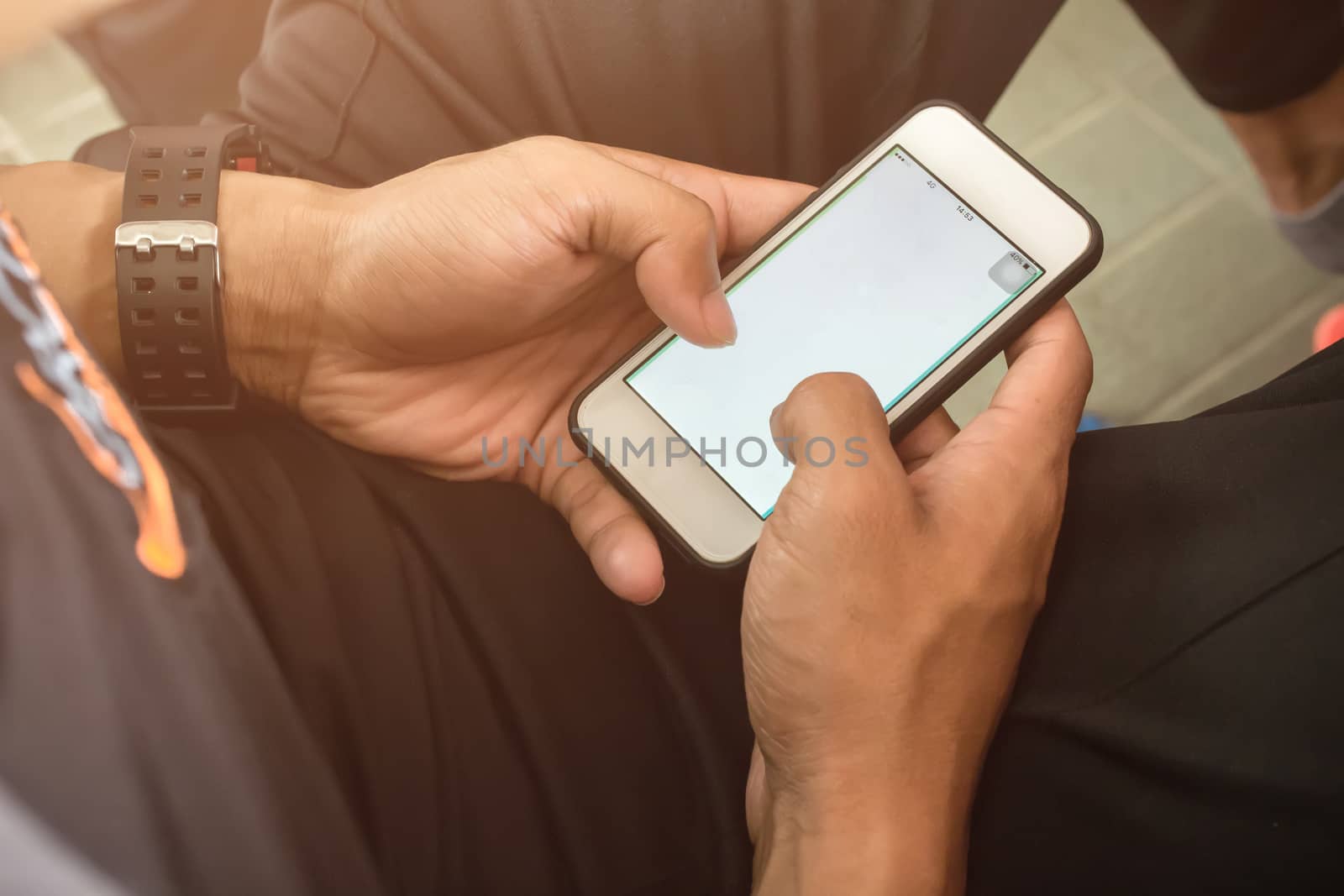 Man using smartphone for play game or online social network.