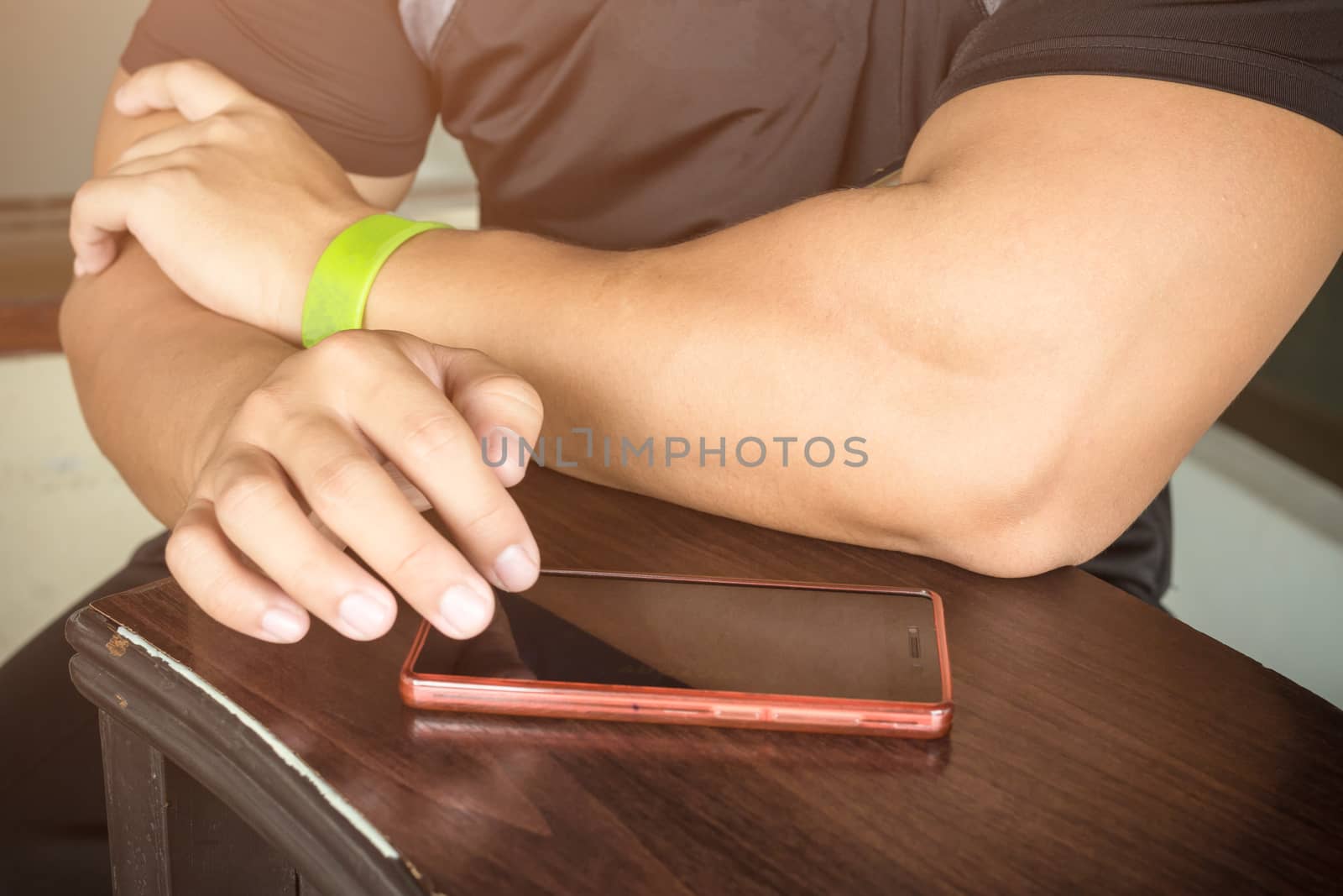 Man using smartphone for play game or online social network.