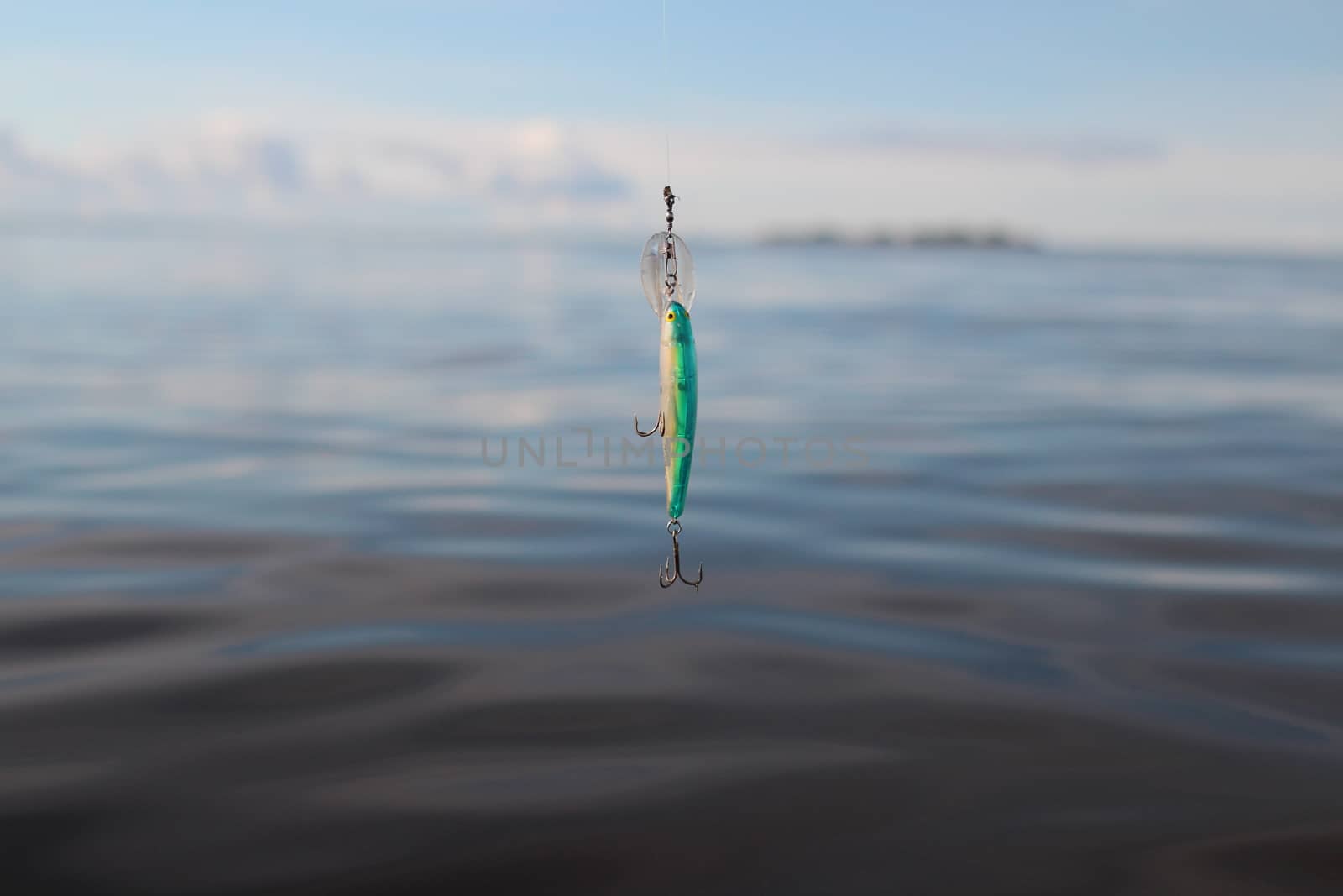 wobbler on the fishing line against the blue sea