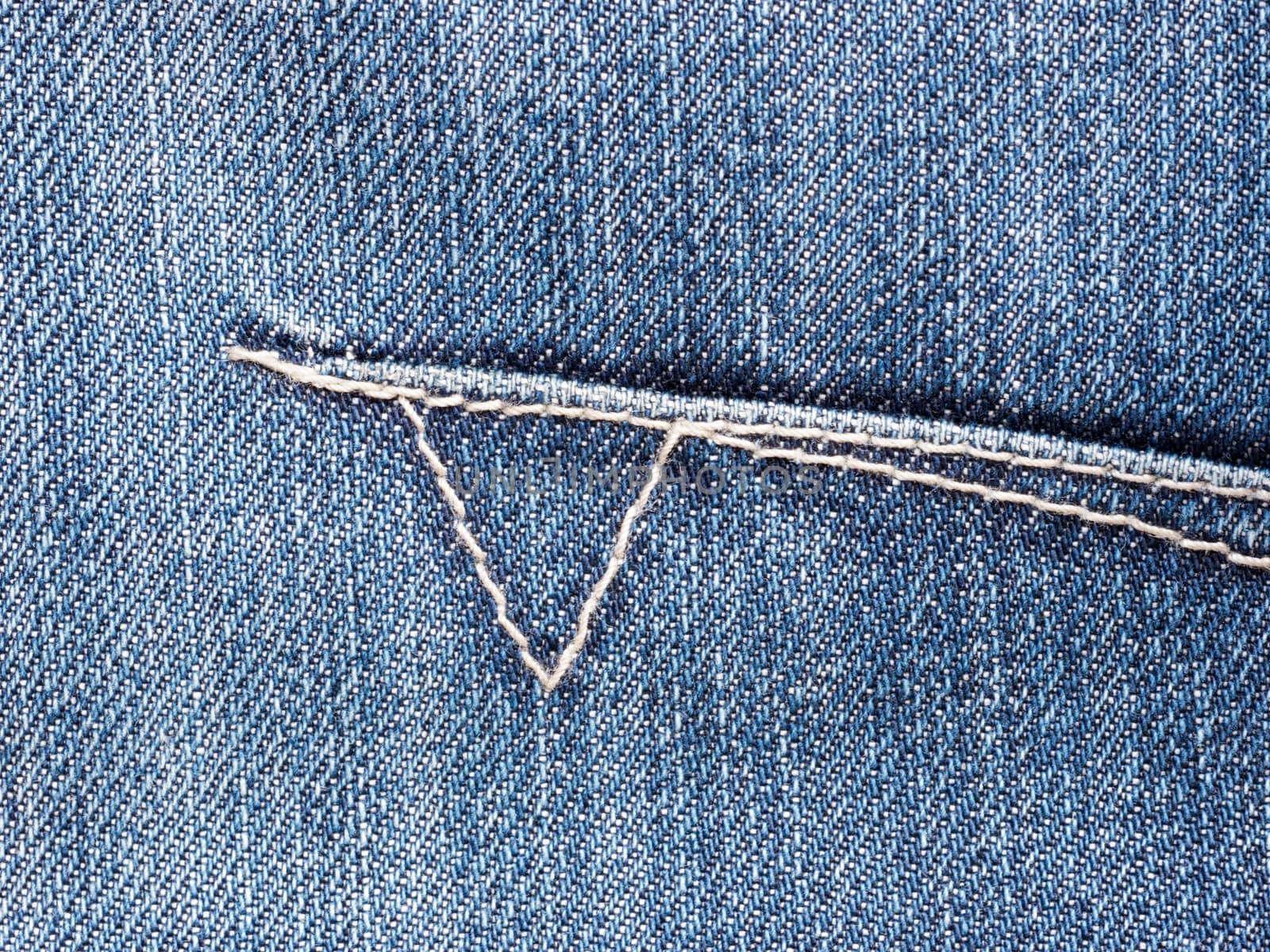 Texture of blue denim jeans with stitch. Denim textile close up