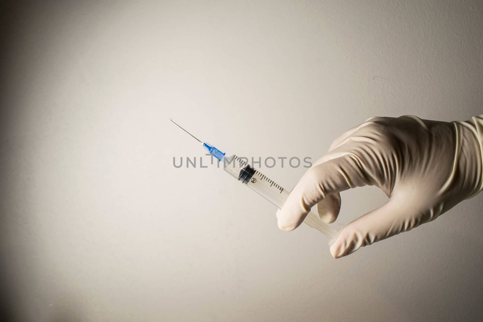 A person holding a syringe