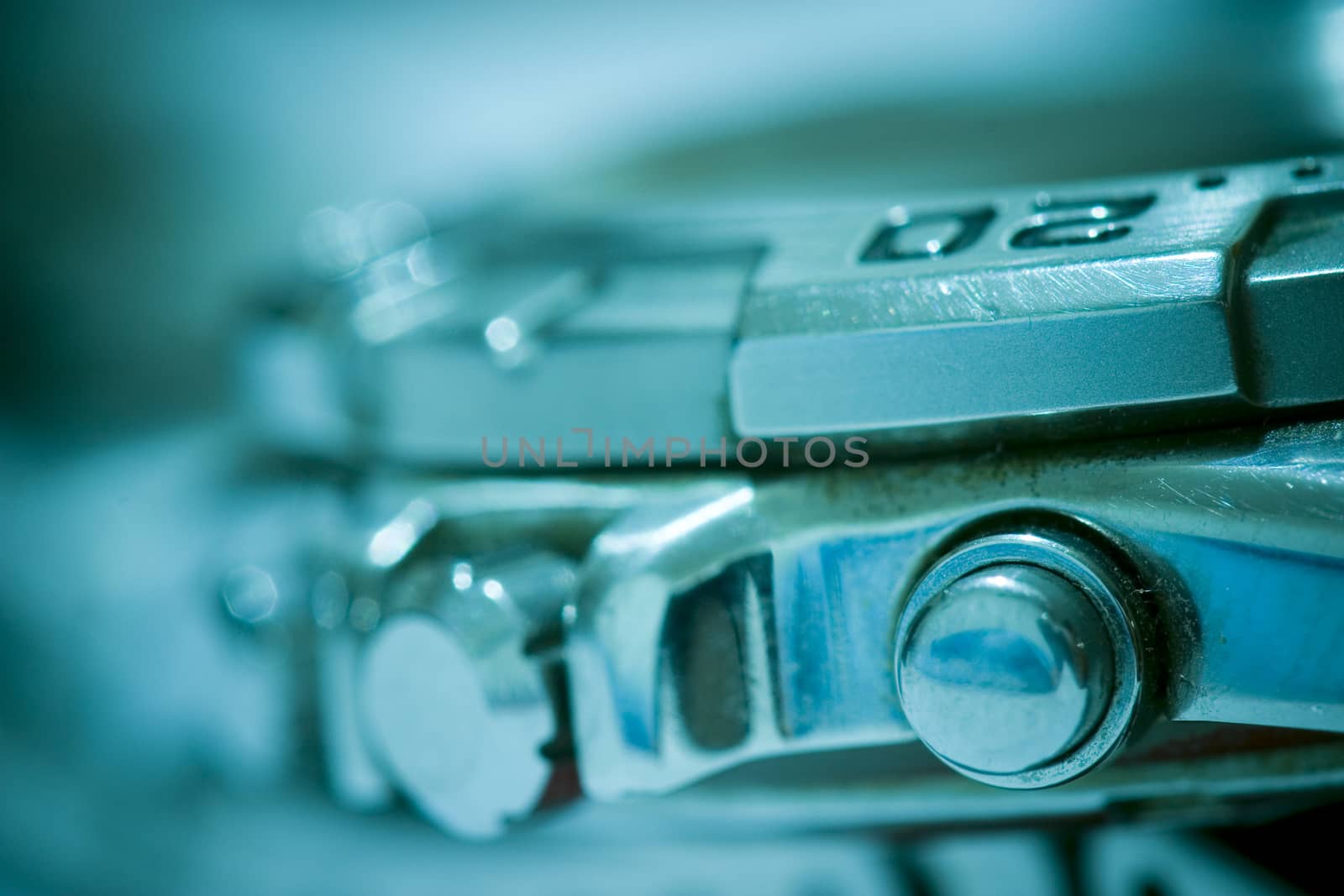 Macro detail of a nice swiss made watch, focus on the adjustment buttons.