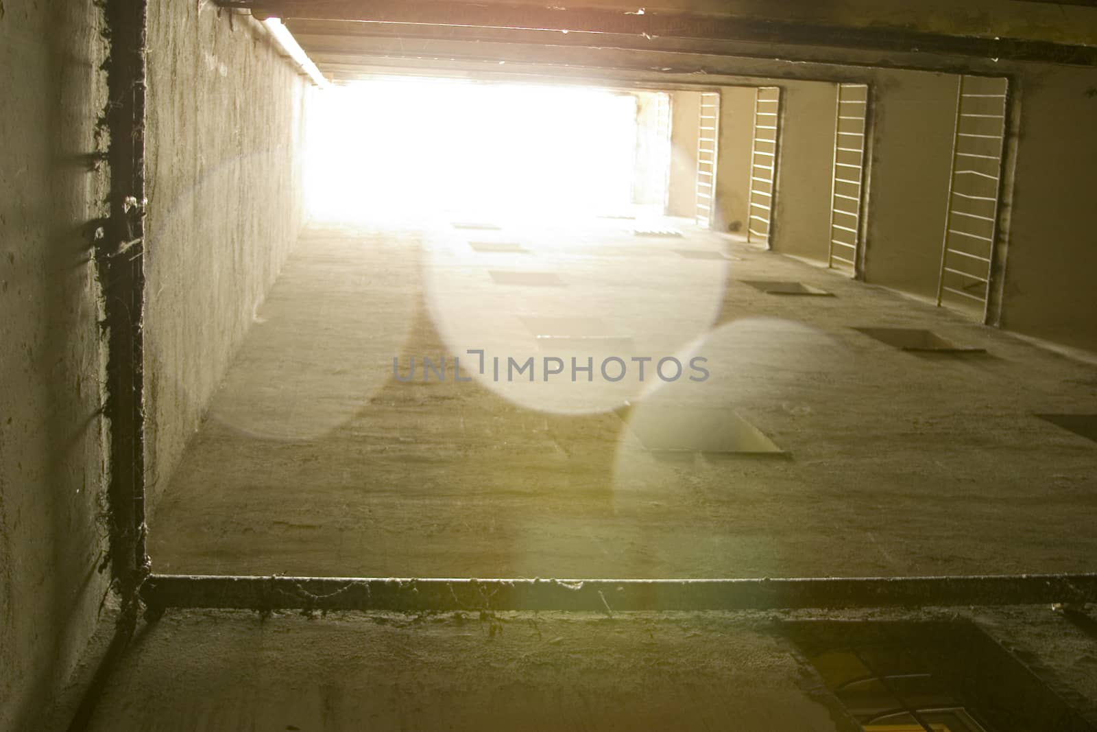 Perspective inside of a apartment block in Bucharest, architecture details, shot backlit with lens flare visible - Romania, common scenery in a EU capital ...