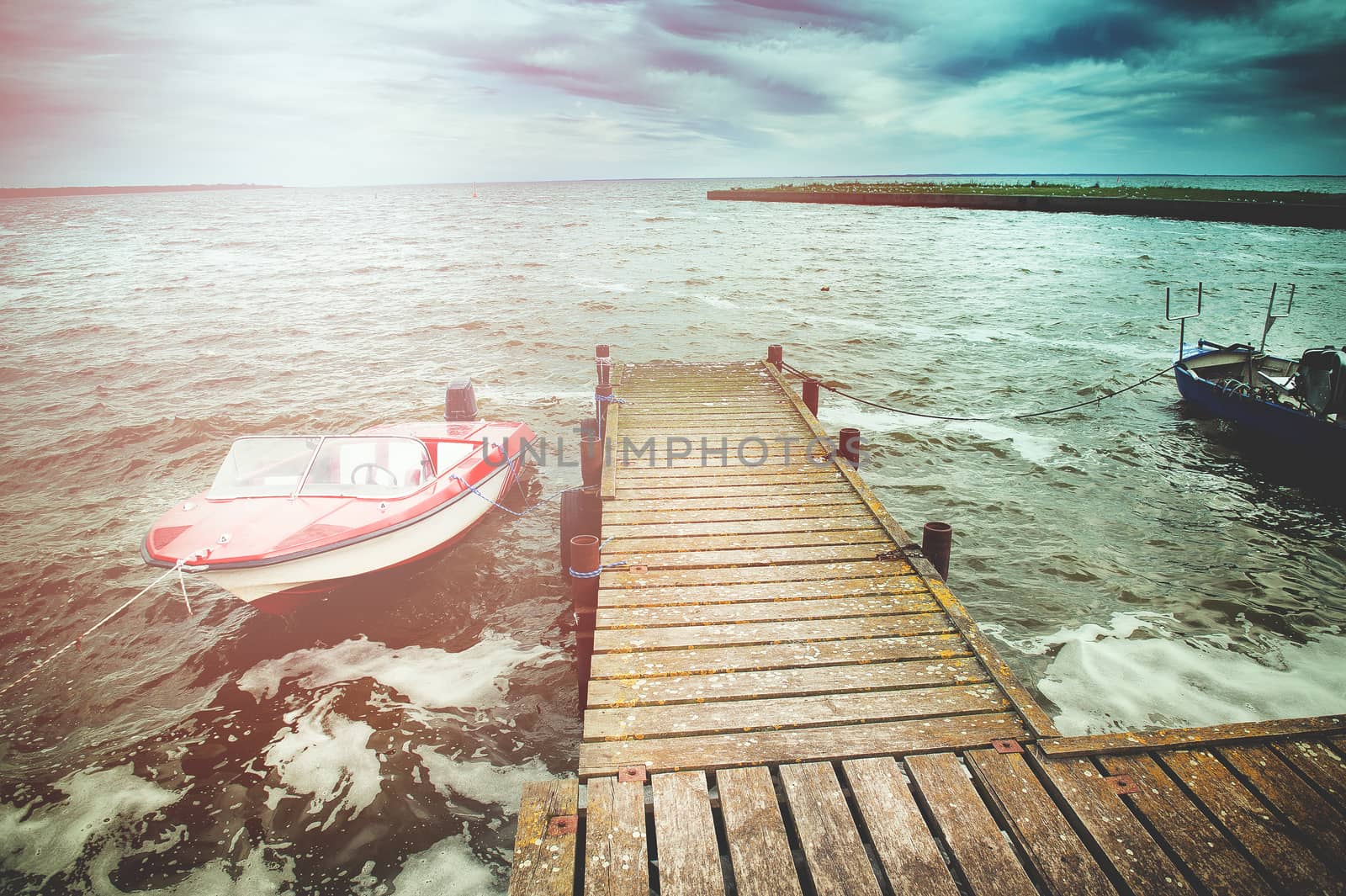 An image of boat moored in the harbor
